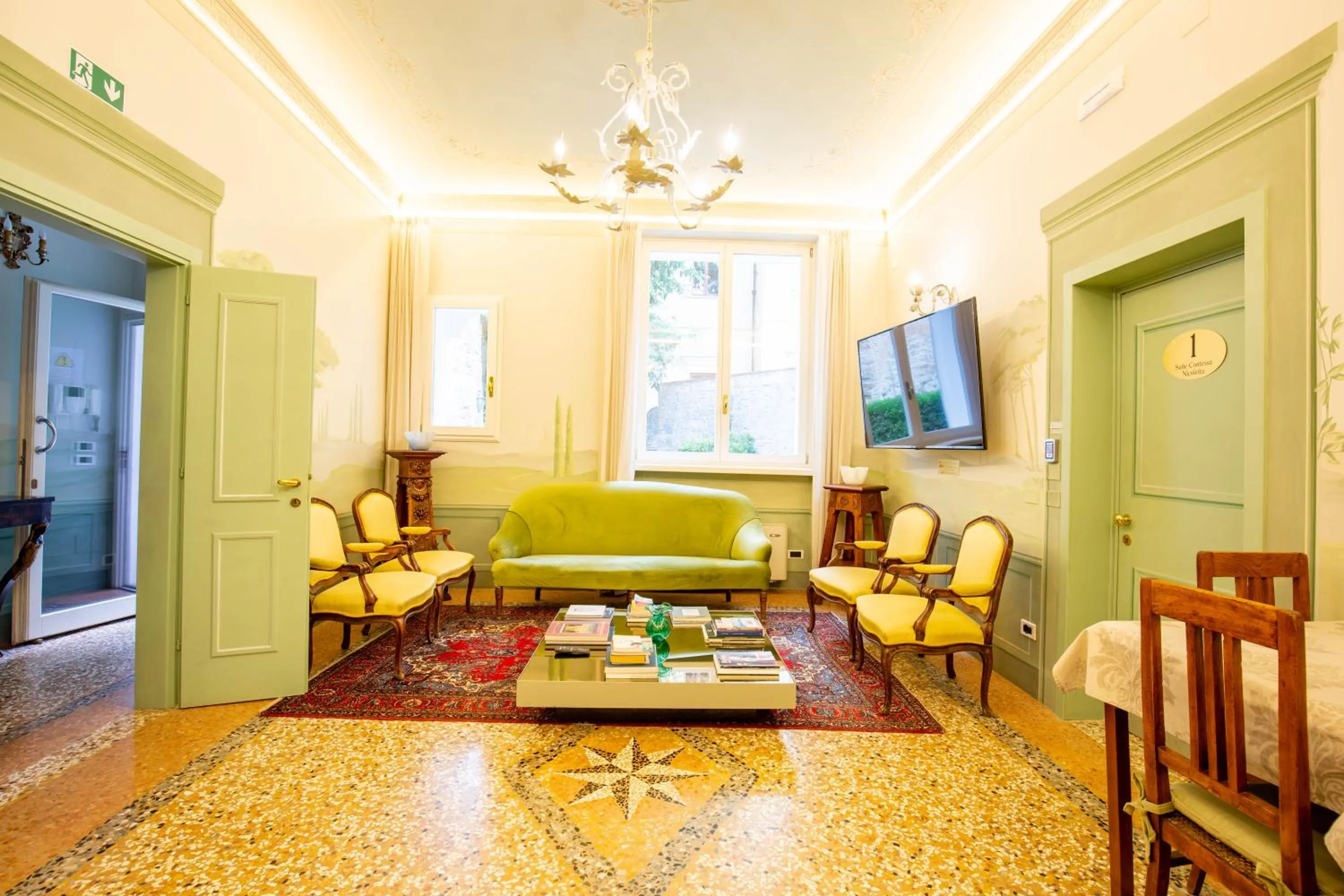 Communal lounge/ TV room in Villa Tortorelli