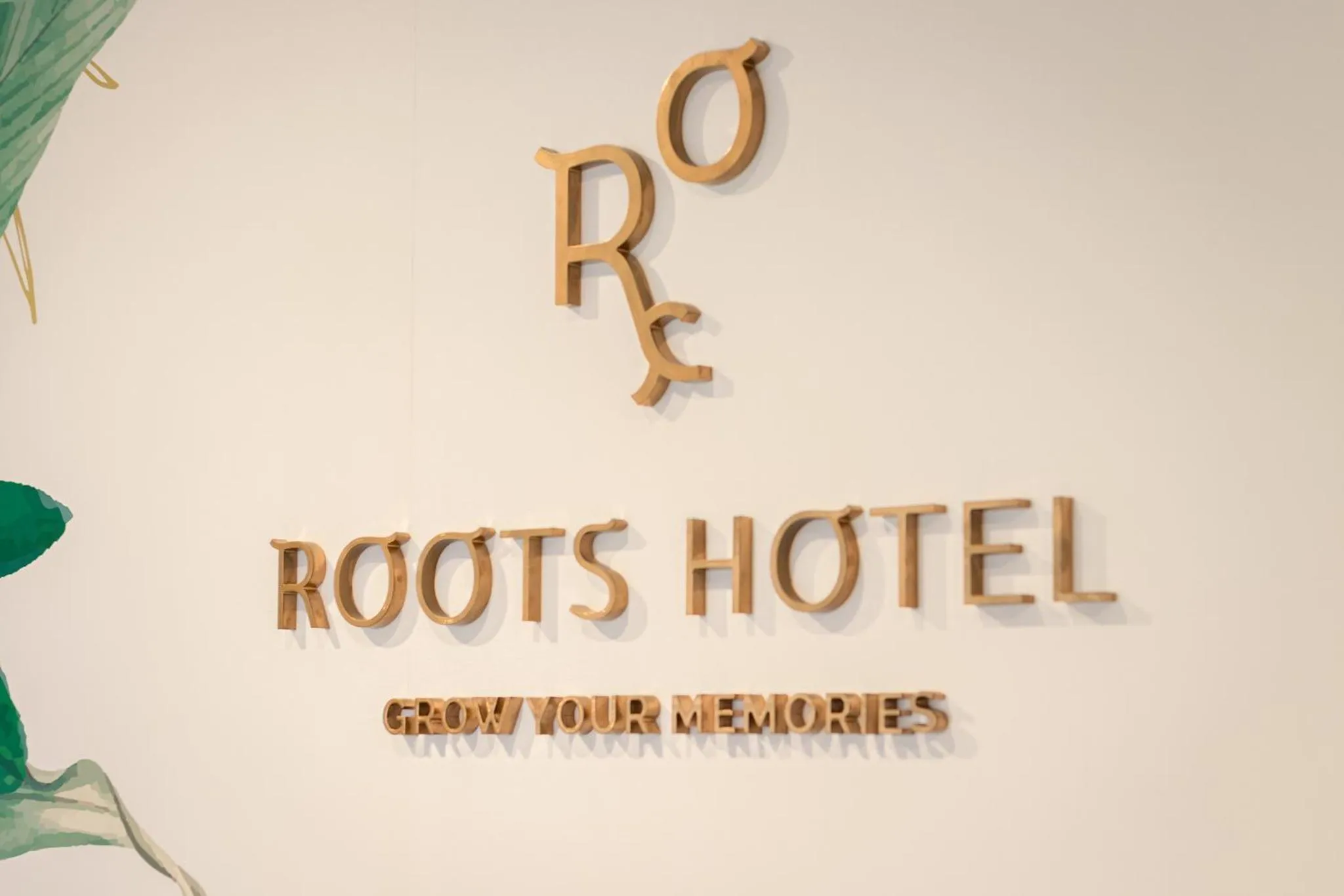 Property logo or sign in Roots Hotel