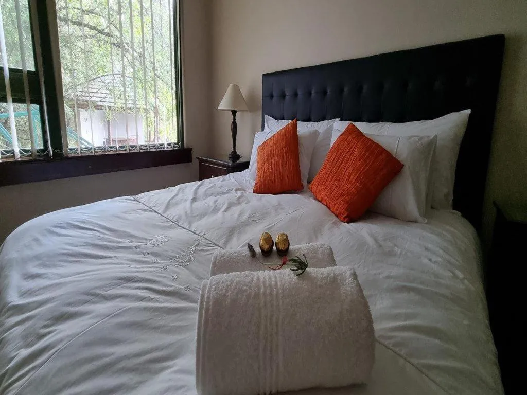 Bed in Cussonia Country Home