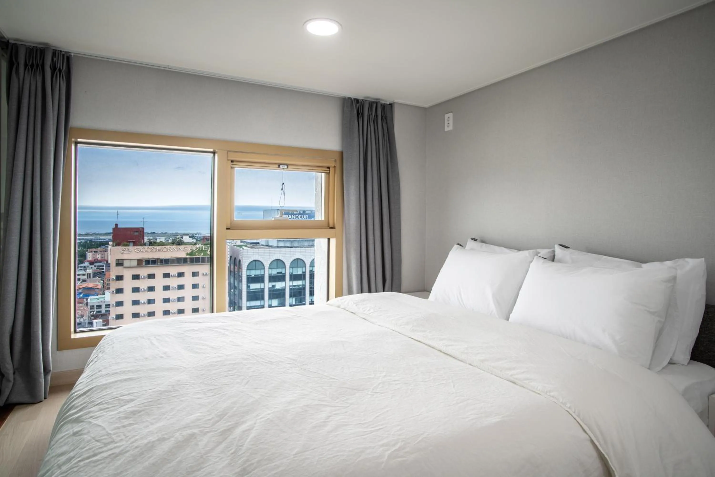 Bed in Jeju Central Park Residence