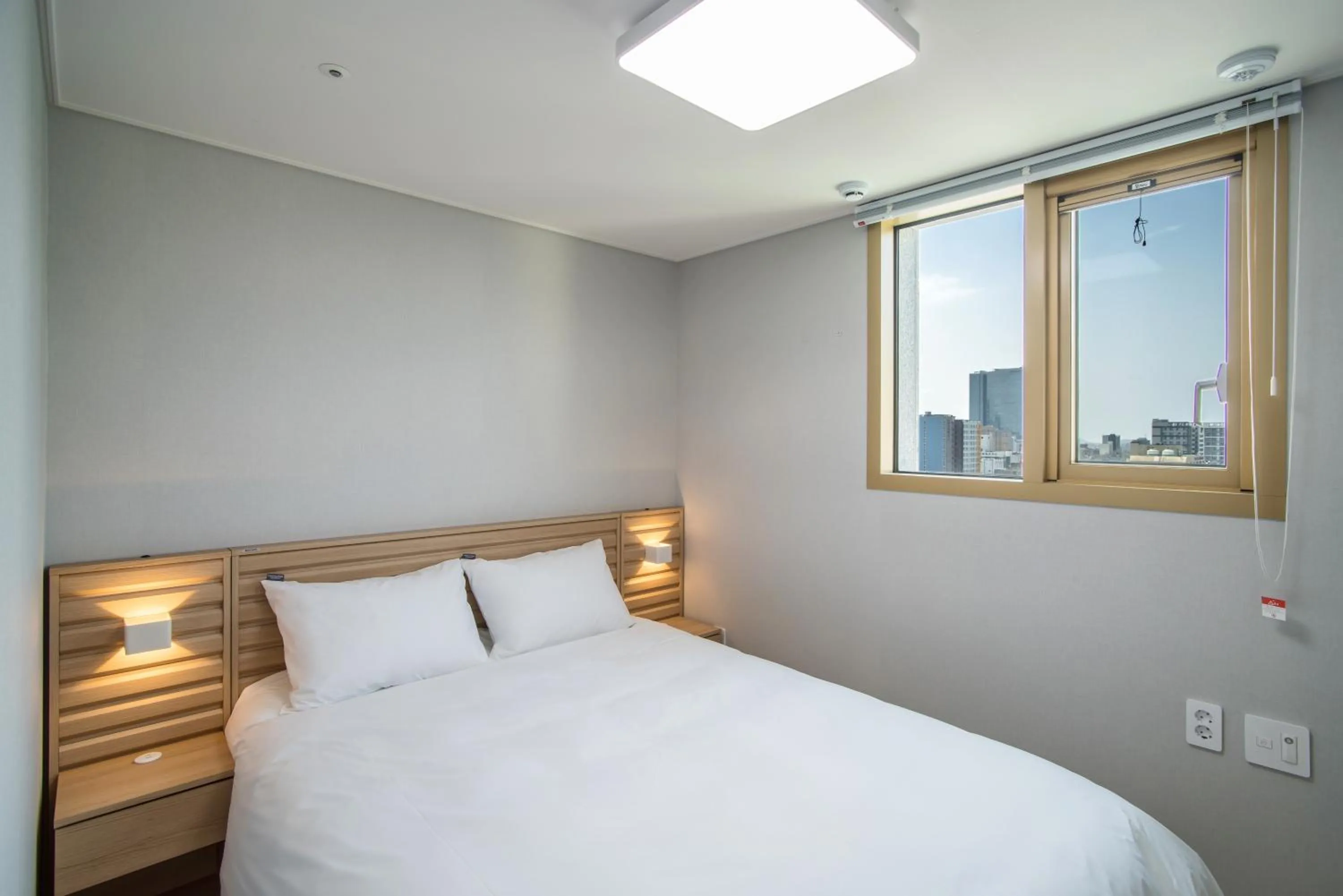 Bedroom, Bed in Jeju Central Park Residence