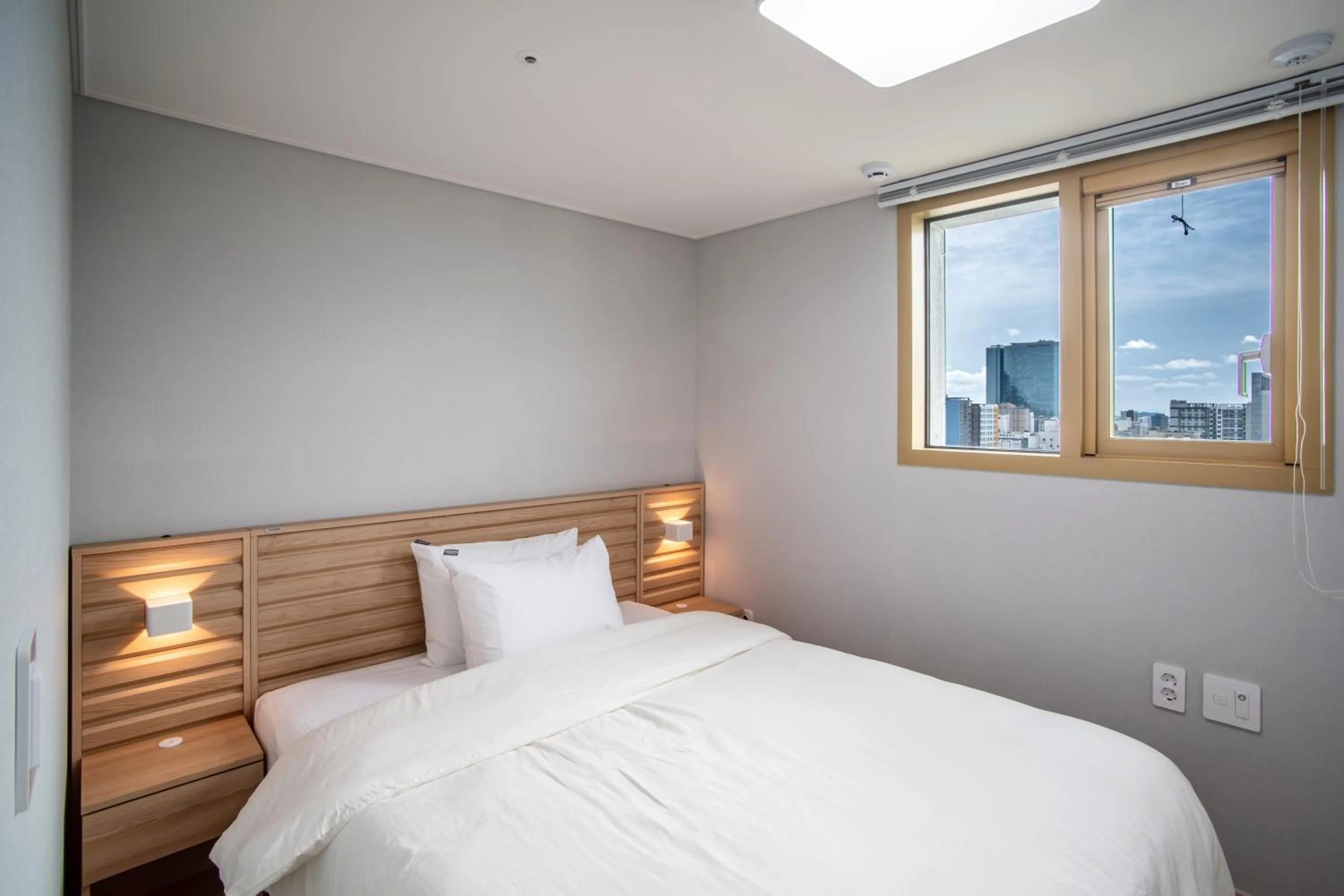 Bed in Jeju Central Park Residence