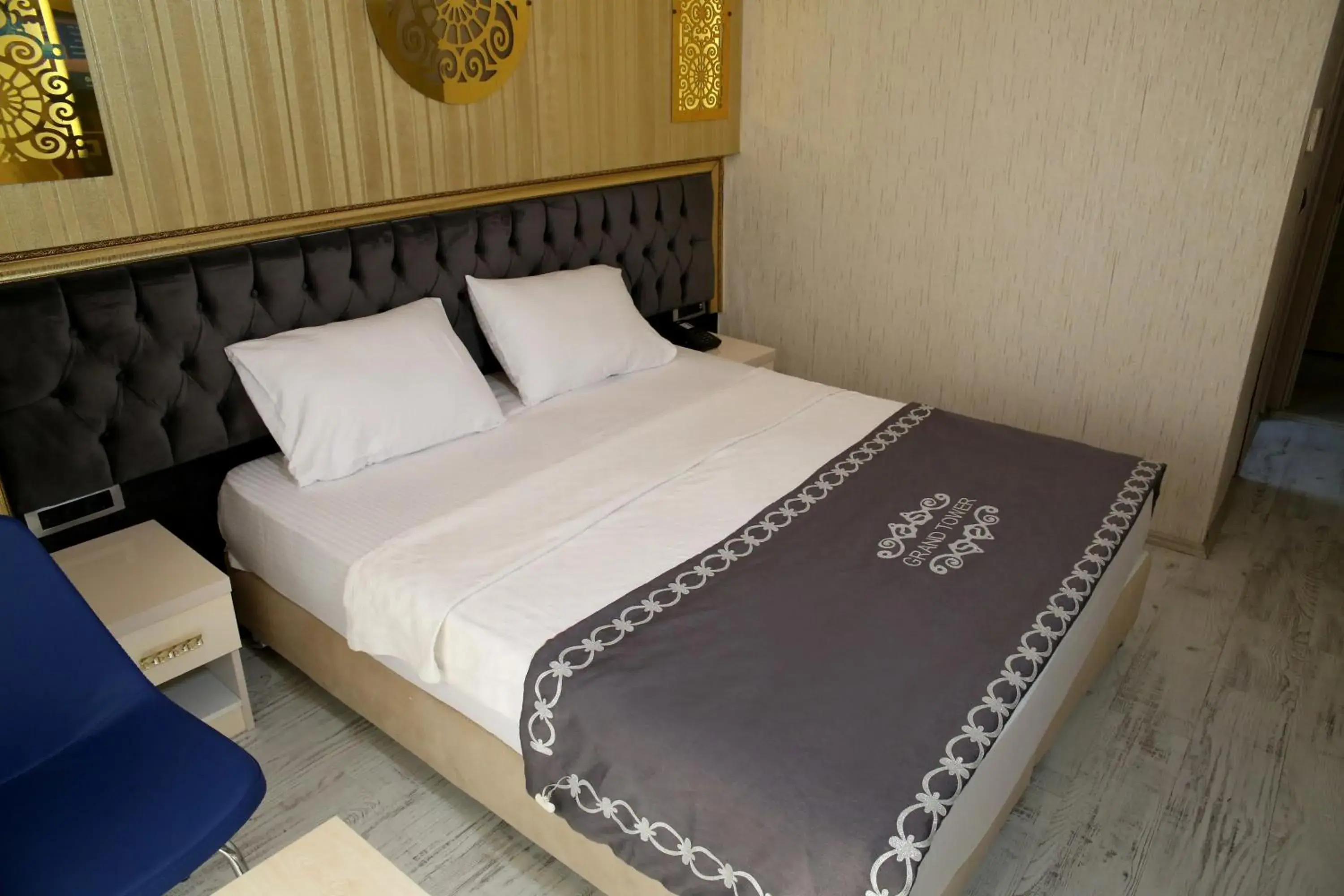 Bed in The Grand Tower Hotel Bed in The Grand Tower Hotel