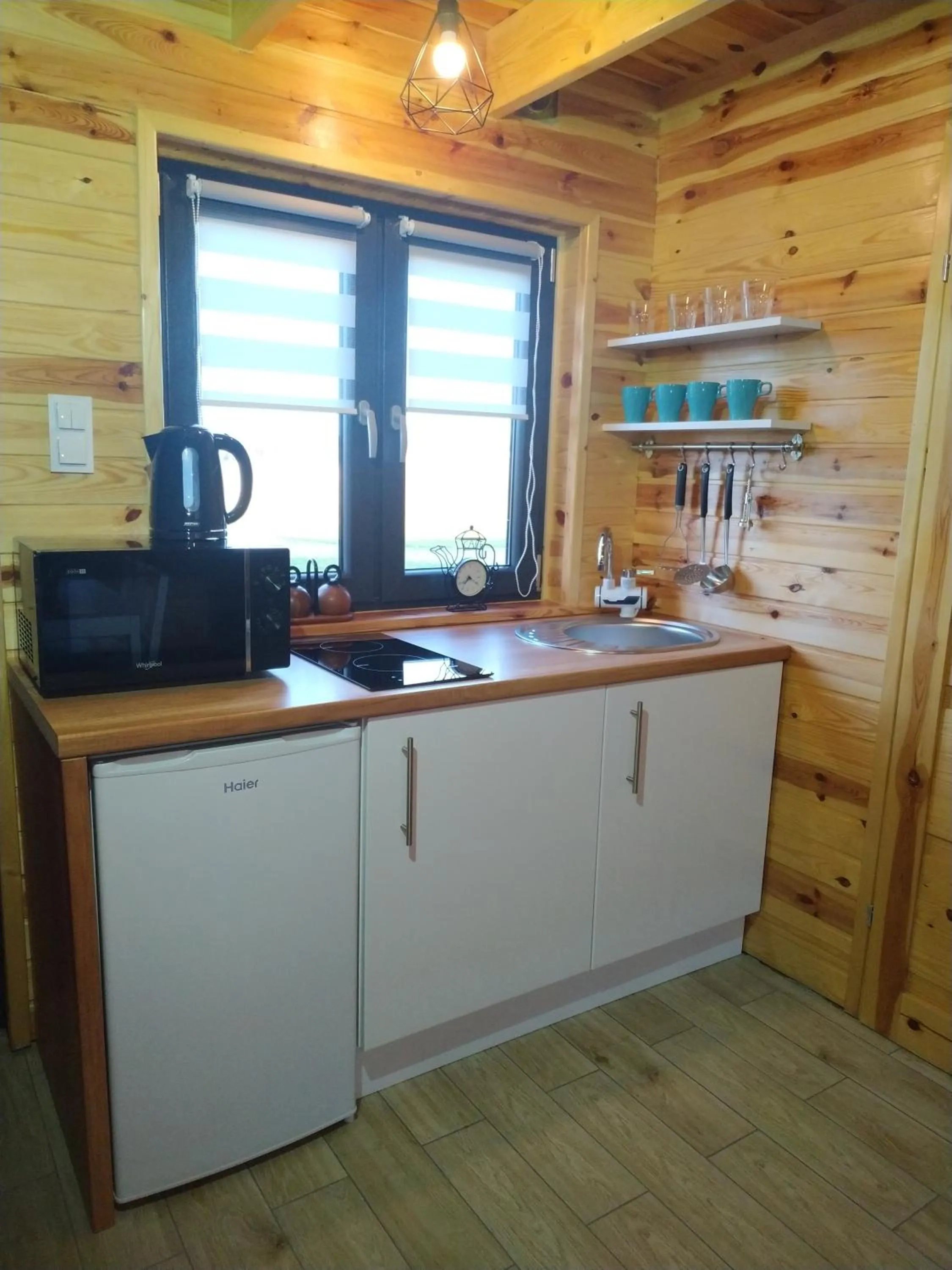 Kitchen or kitchenette in Domki Arkadia Mielno