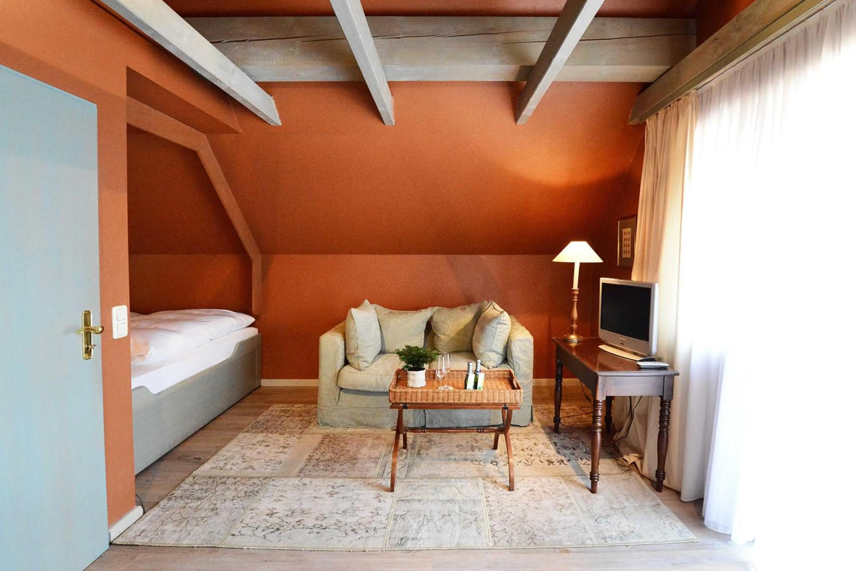 Seating area, Bed in Romantik Hotel Jagdhaus Waldfrieden