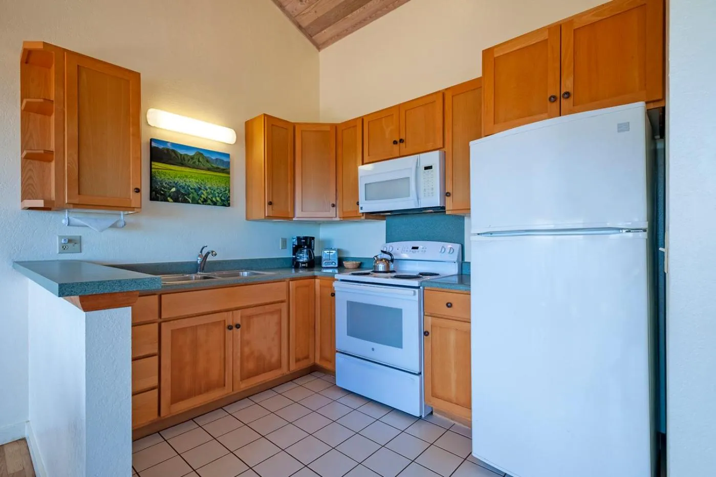 Kitchen or kitchenette in Poipu Plantation Vacation Rentals