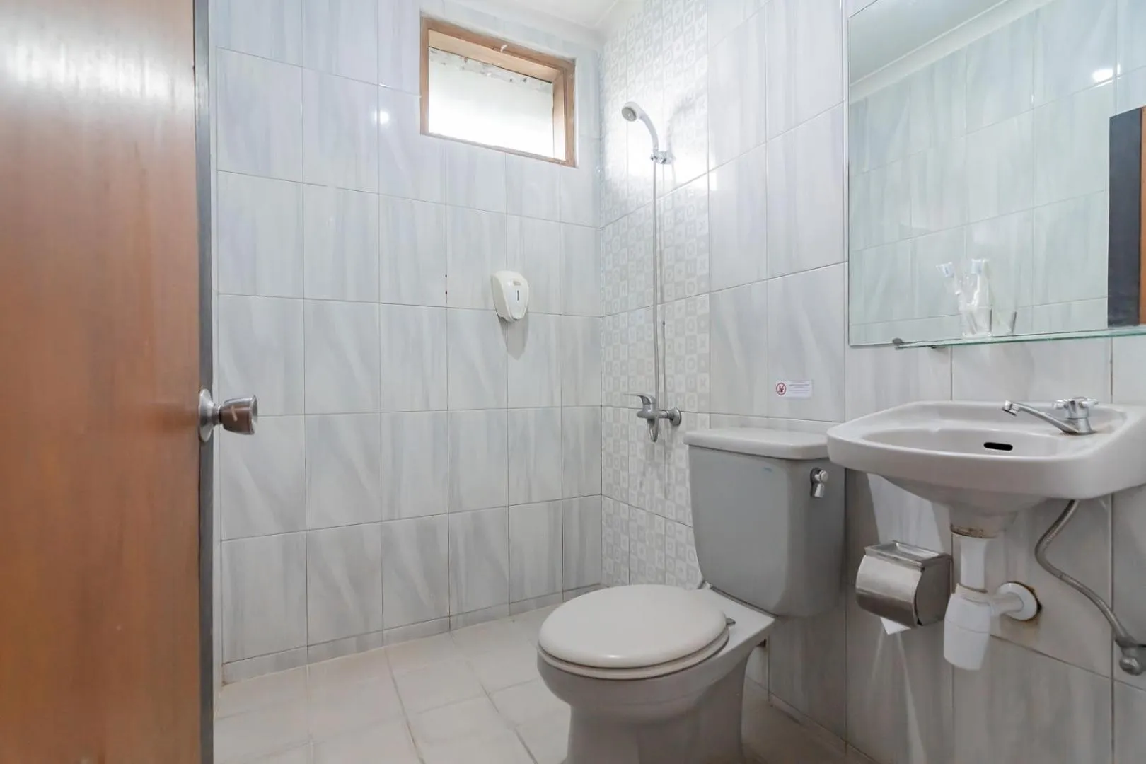 Bathroom in Sans Hotel Cihampelas Bandung