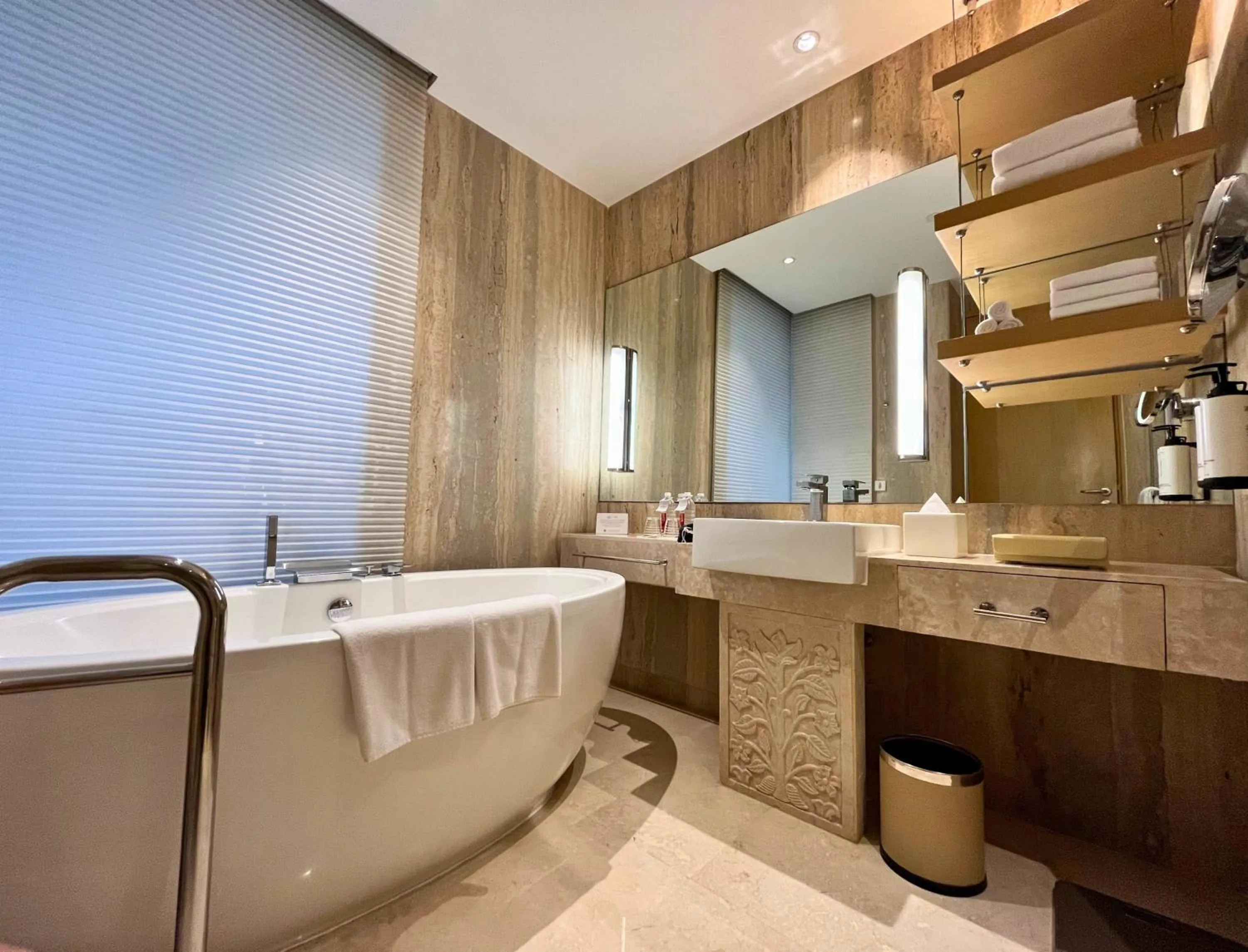 Bathroom in Crowne Plaza Greater Noida by IHG