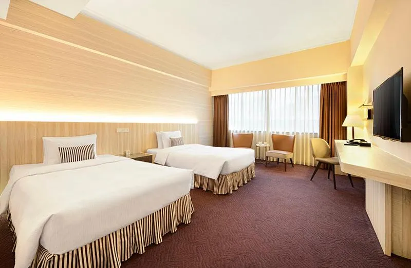 Bed in Caesar Park Hotel Taipei