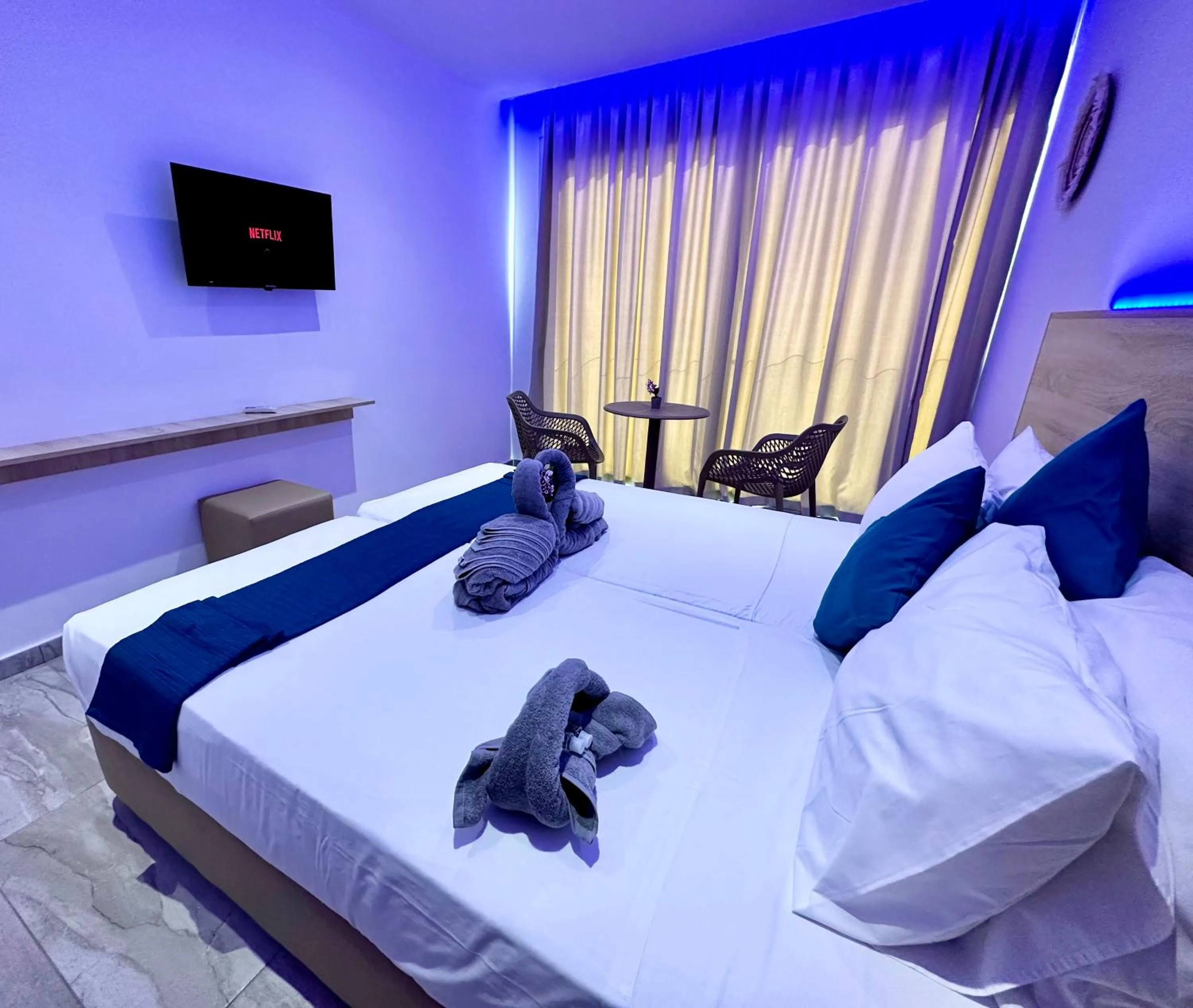 Bed in Sun Plaza Suites - Adults Only