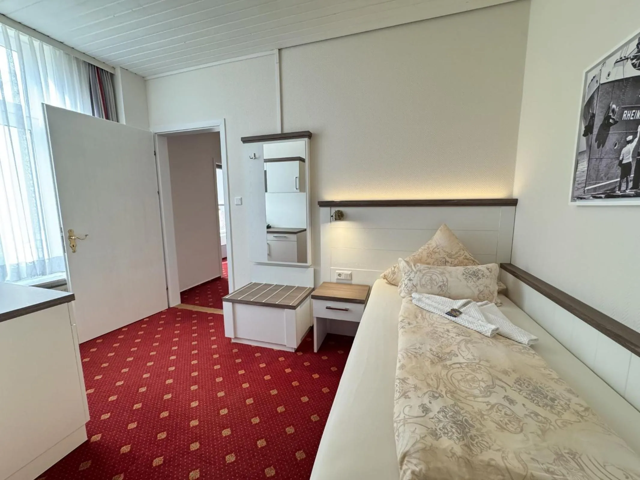 Photo of the whole room, Bed in Hotel Weisse Düne