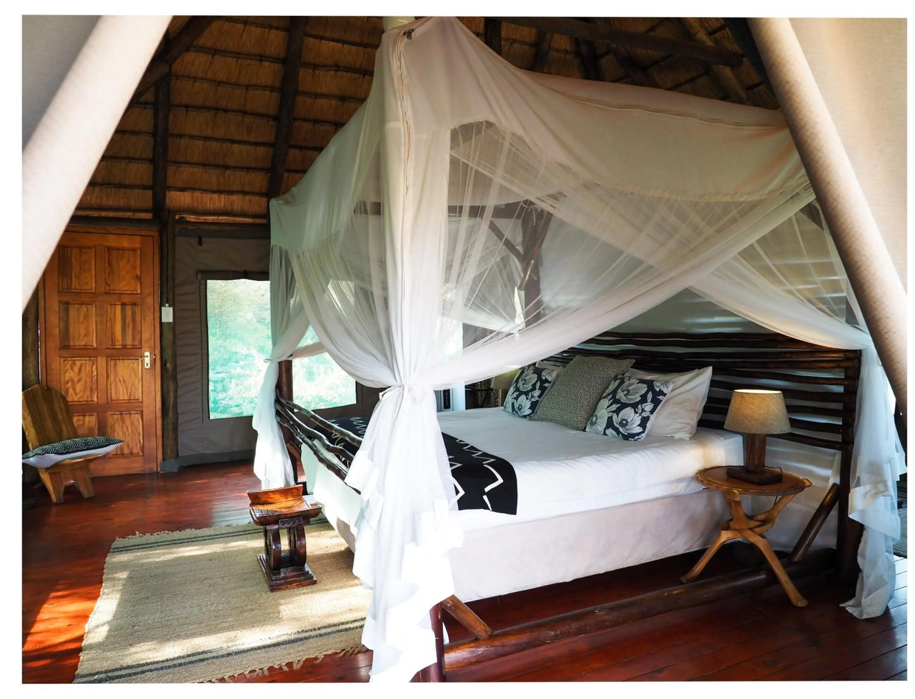 Bed in Muweti Bush Lodge