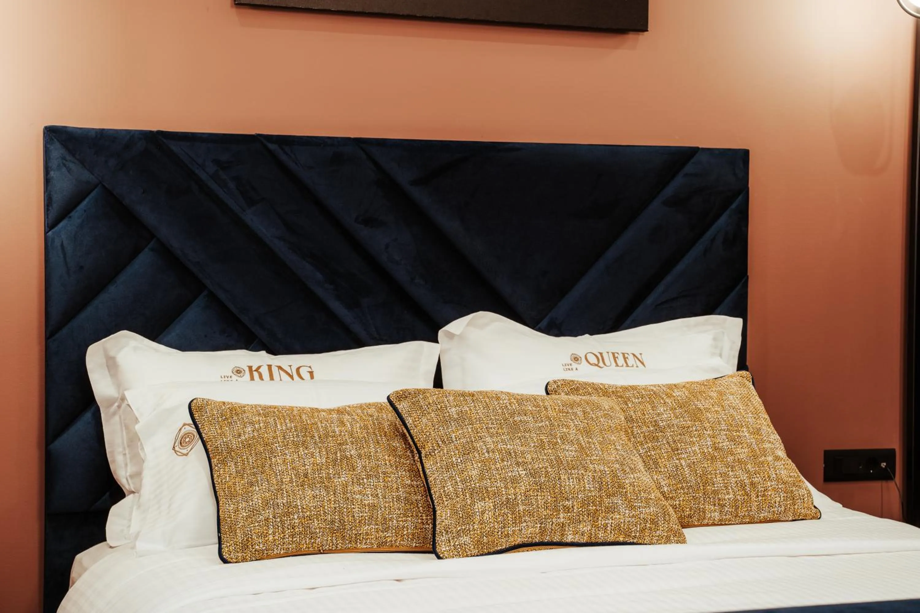 Bed in Espero Royal Stay