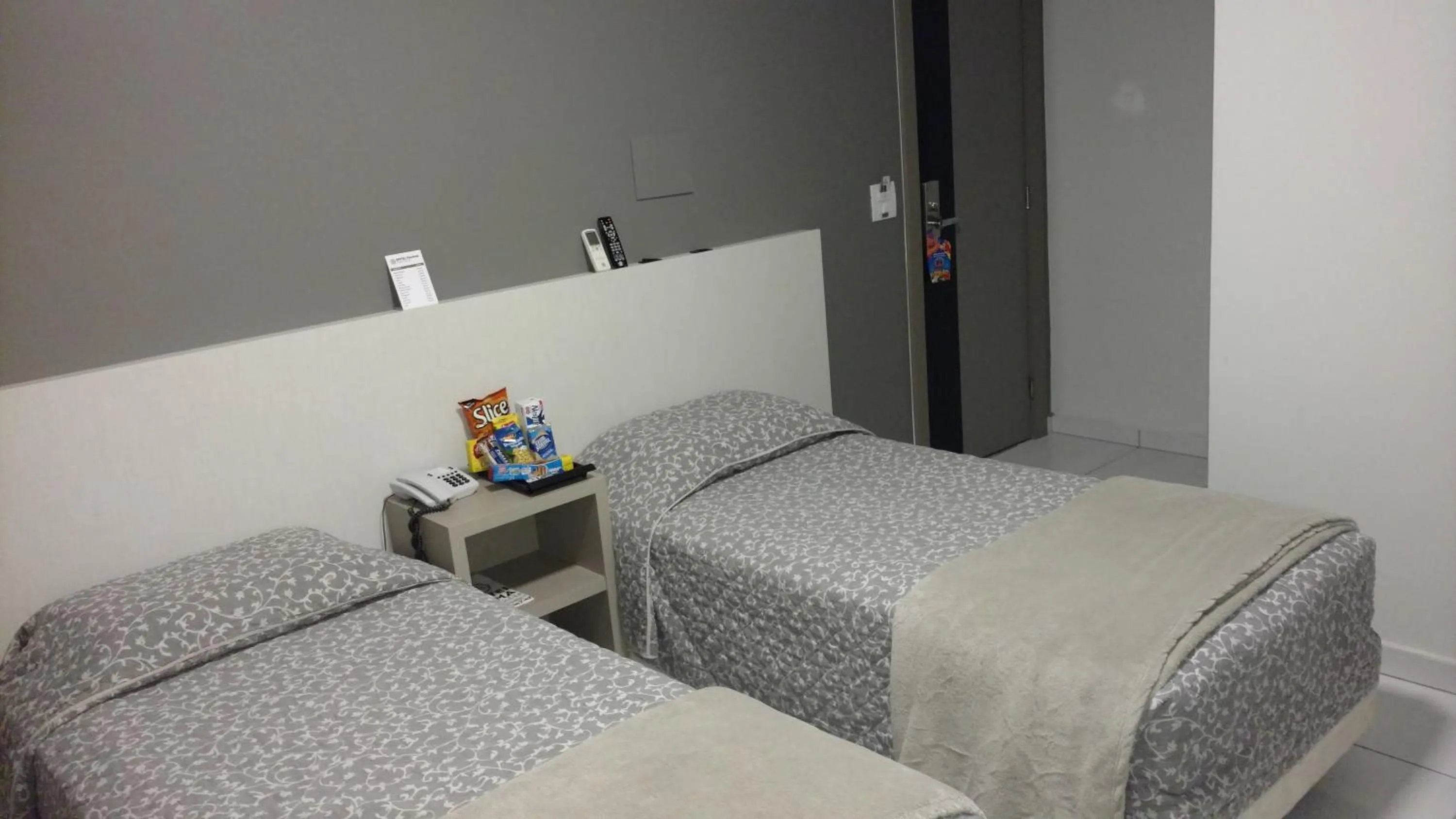 Bed in Hotel Palmas Executivo