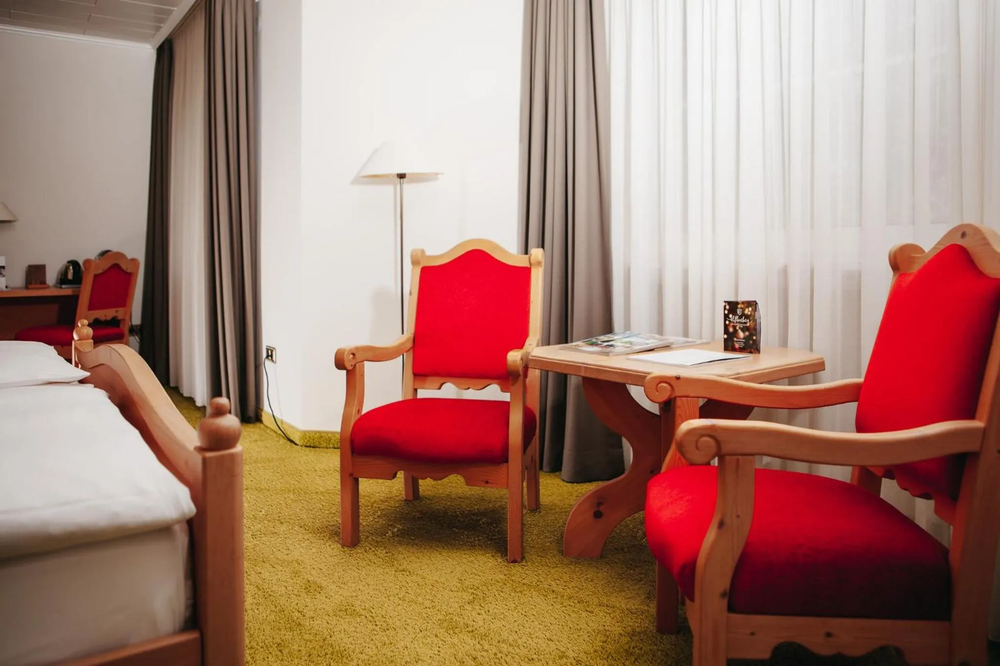 Seating area, Bed in Hotel Elfbuchen