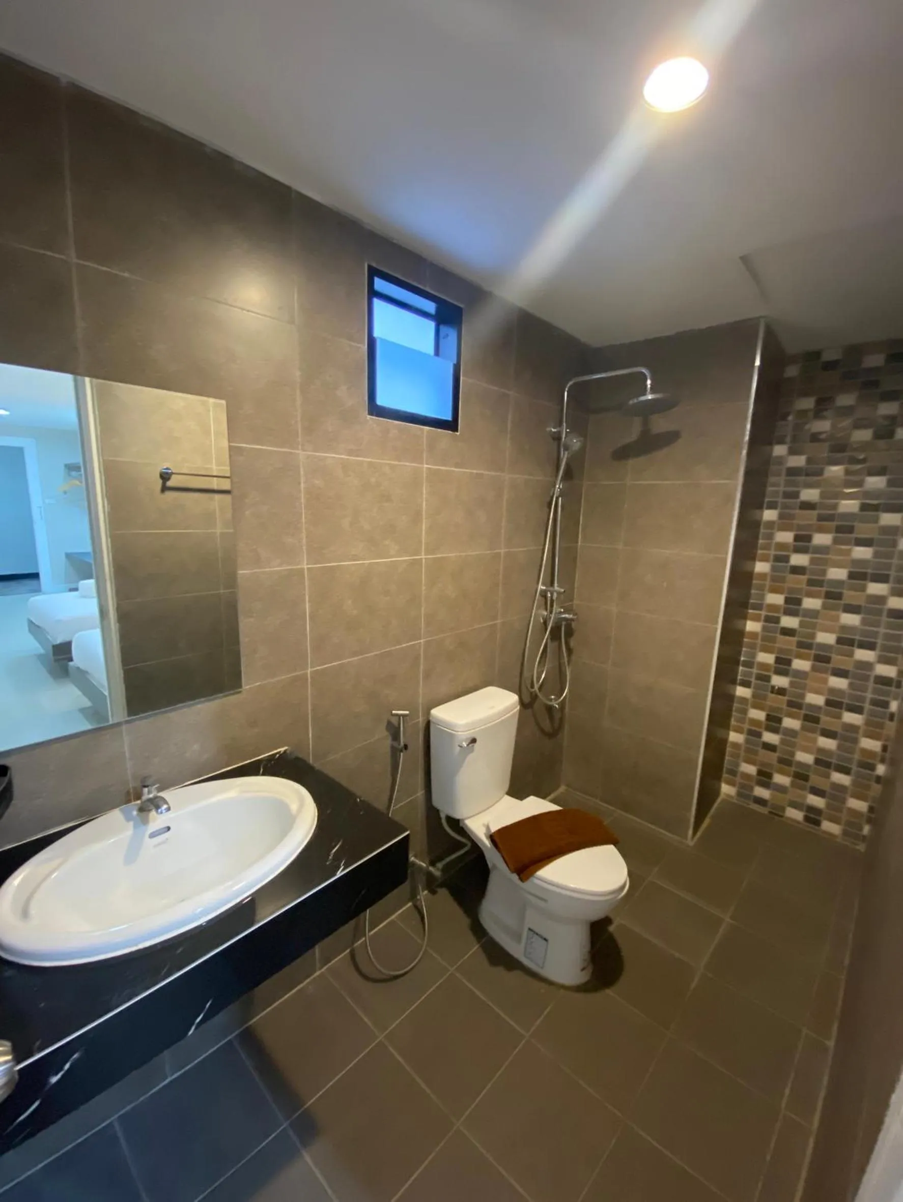 Shower in We Resident Hotel