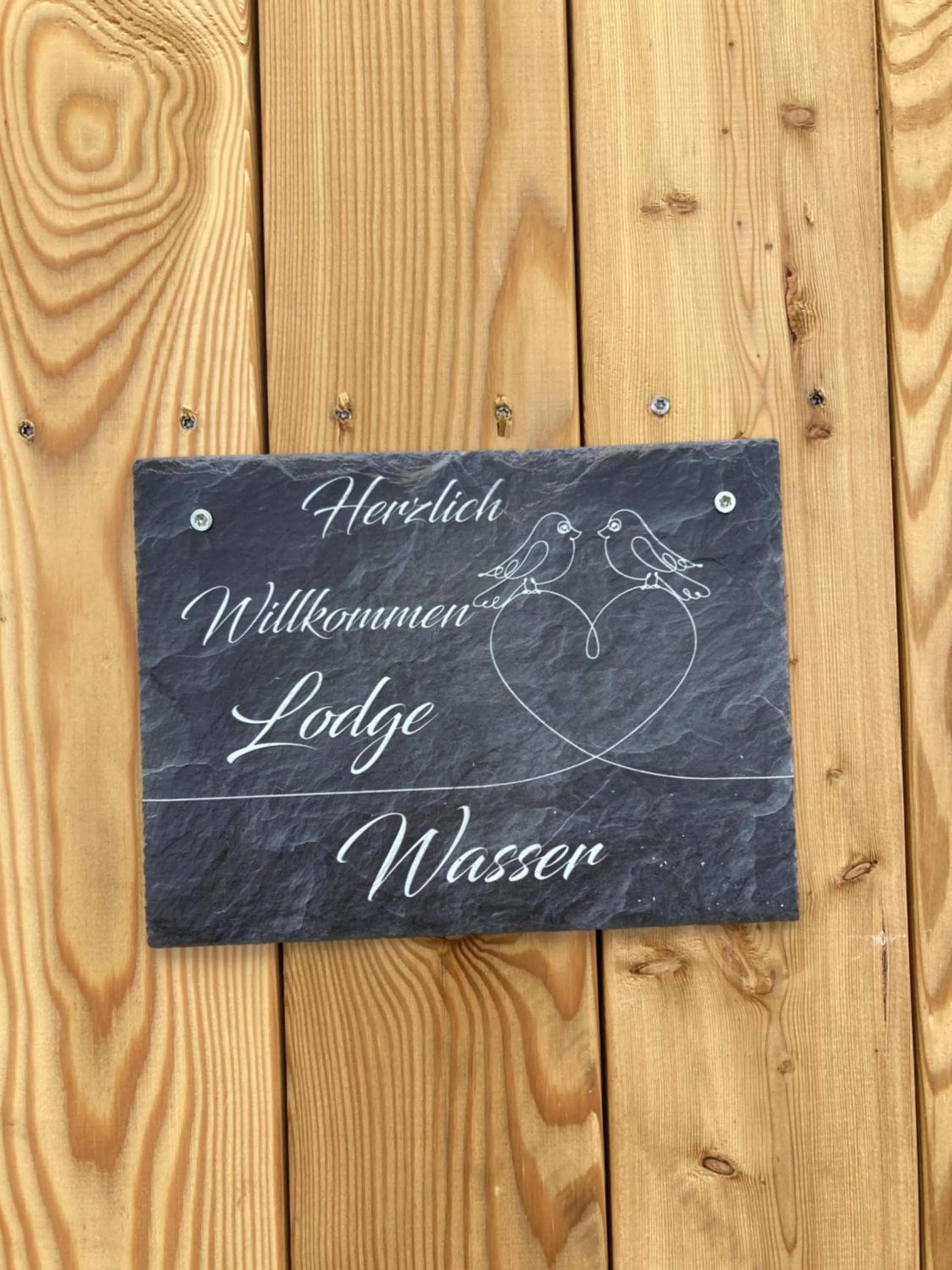 Property logo or sign in Kantor Village am Millstätter See - Boutique-Chalets und Lodges