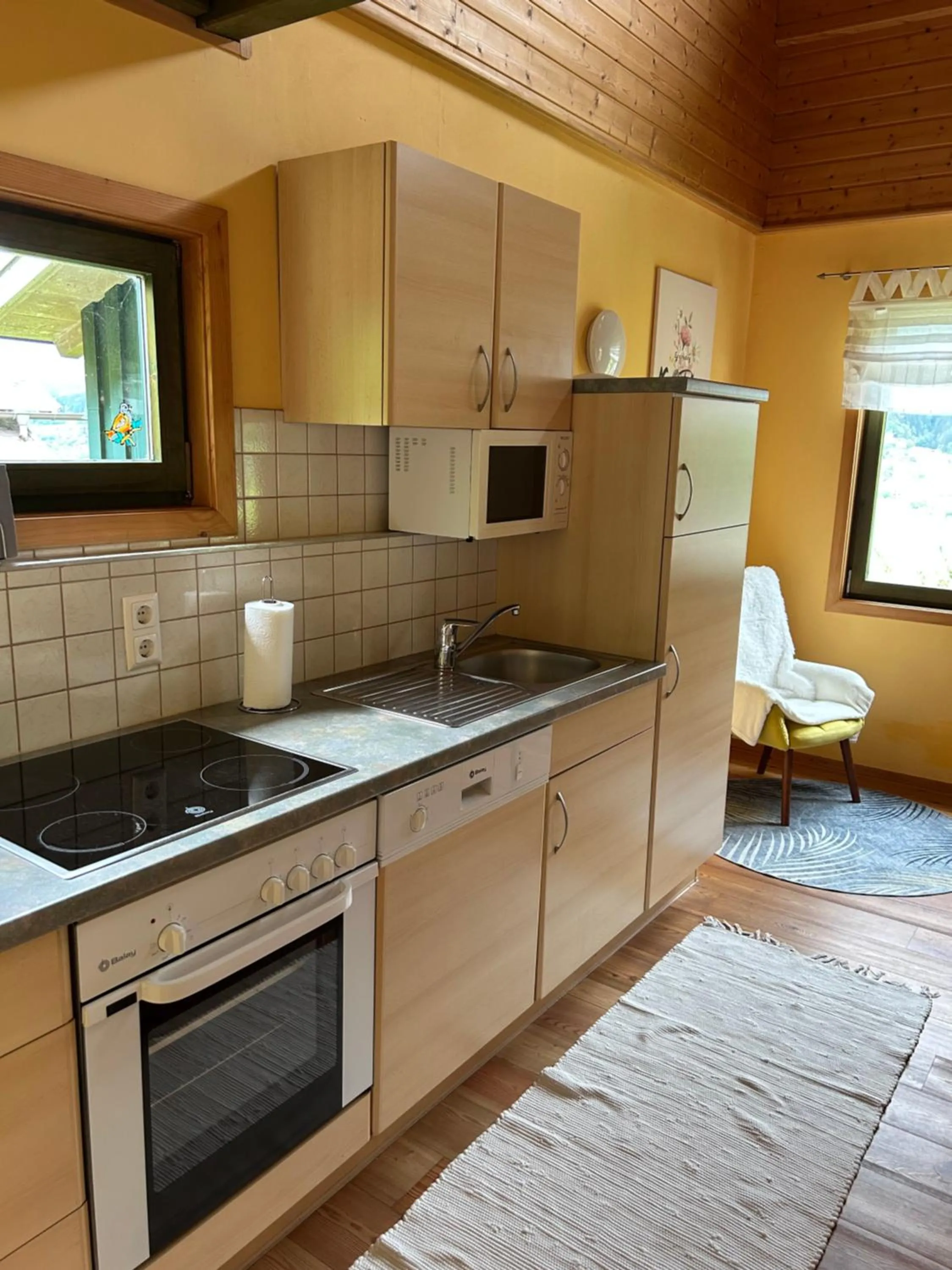 Kitchen or kitchenette in Kantor Village am Millstätter See - Boutique-Chalets und Lodges