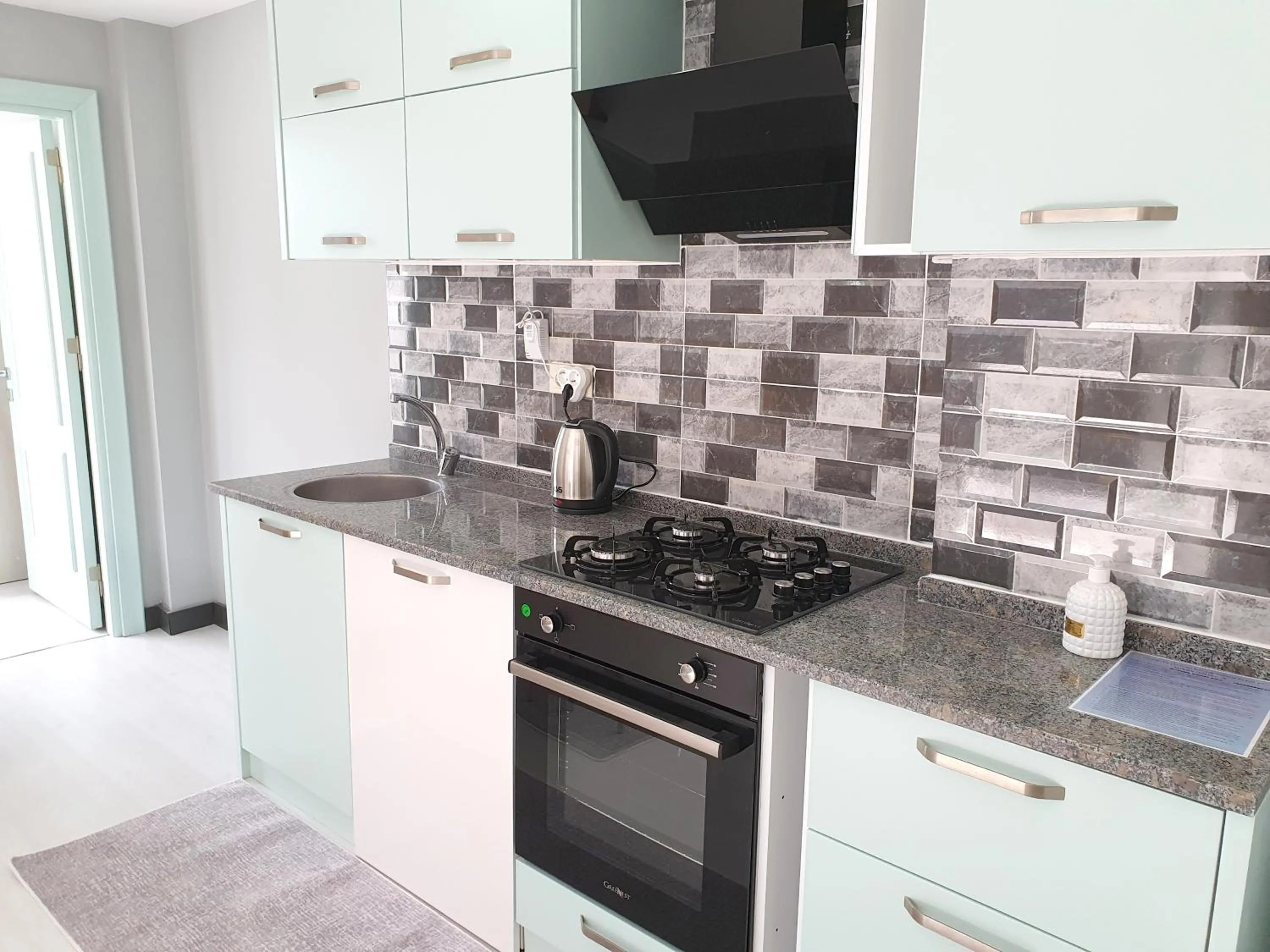 Kitchen or kitchenette in Home Mood Apart Hotel