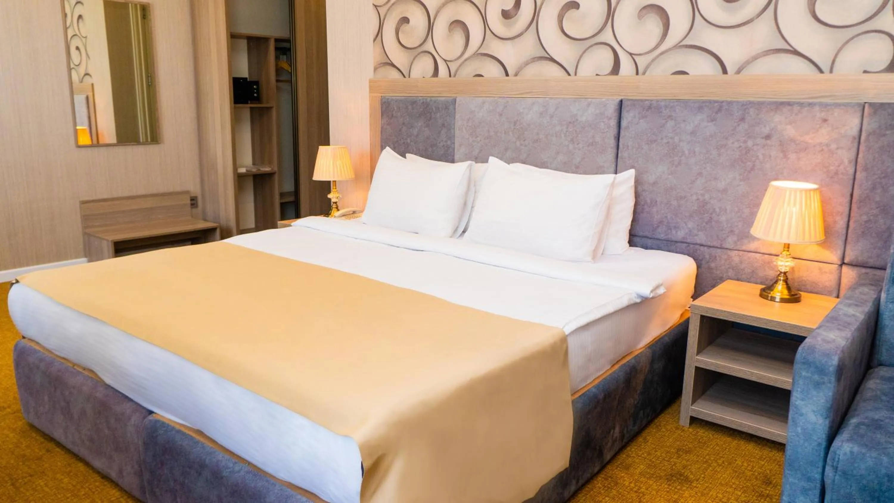 Bed in Grand Midway Hotel