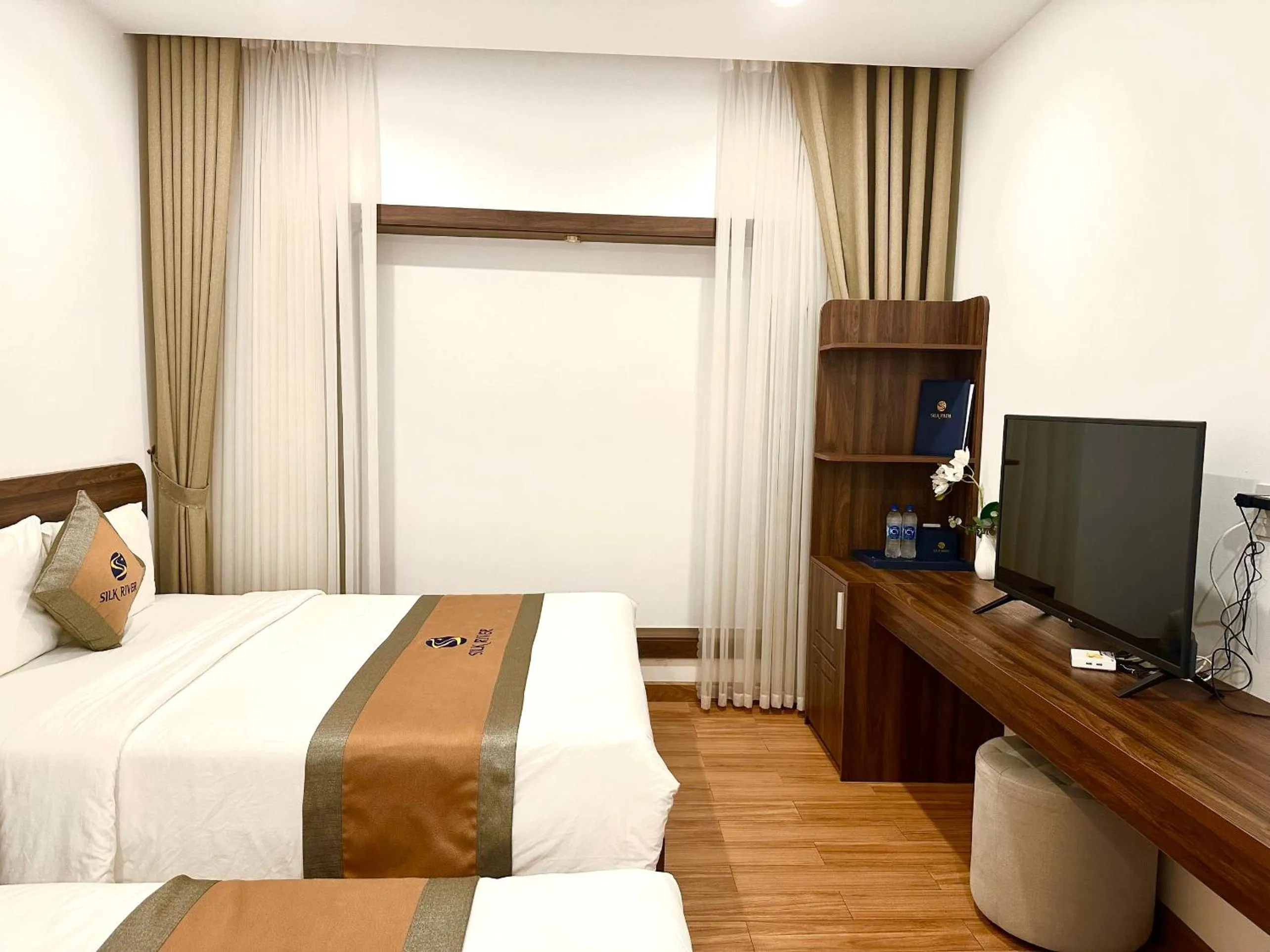 Bed in Silk River Hotel Ha Giang