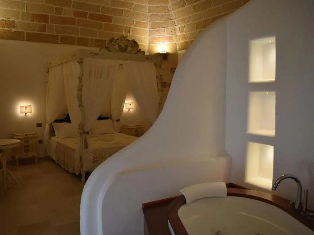 Bed in PLAZACARRISI HOTEL & SPA