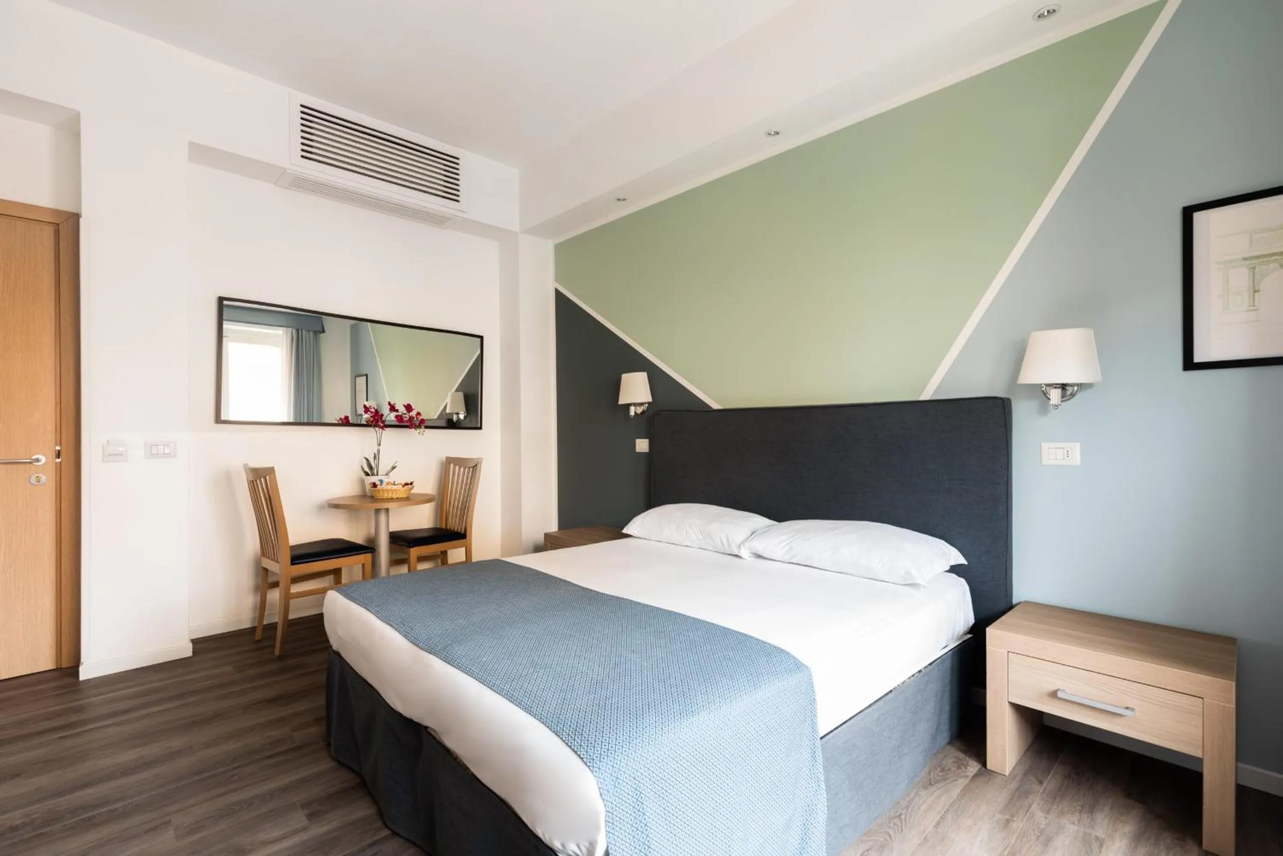 Bed in Fleming Suites by Hili