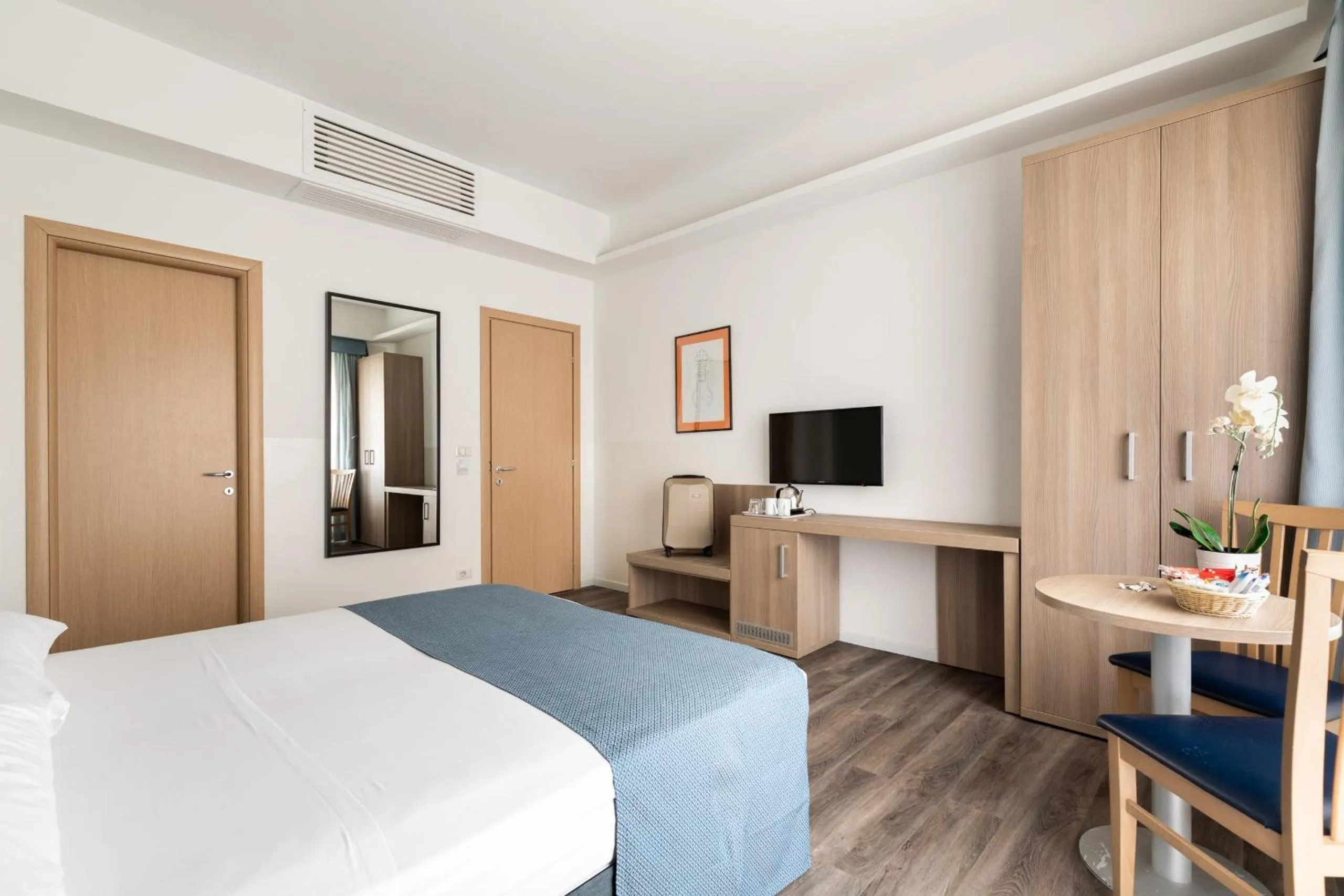 Bed in Fleming Suites by Hili