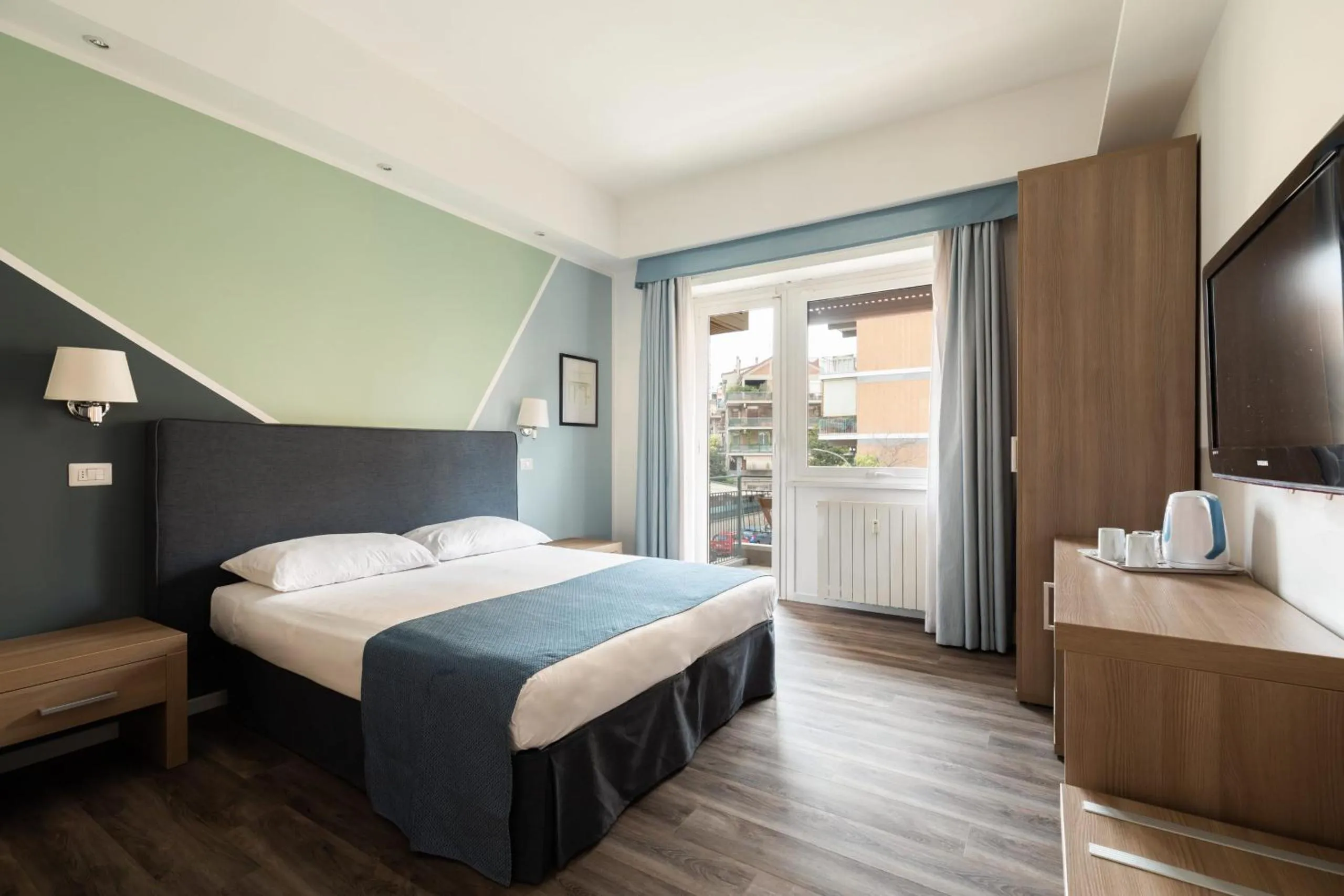 TV and multimedia, Bed in Fleming Suites by Hili