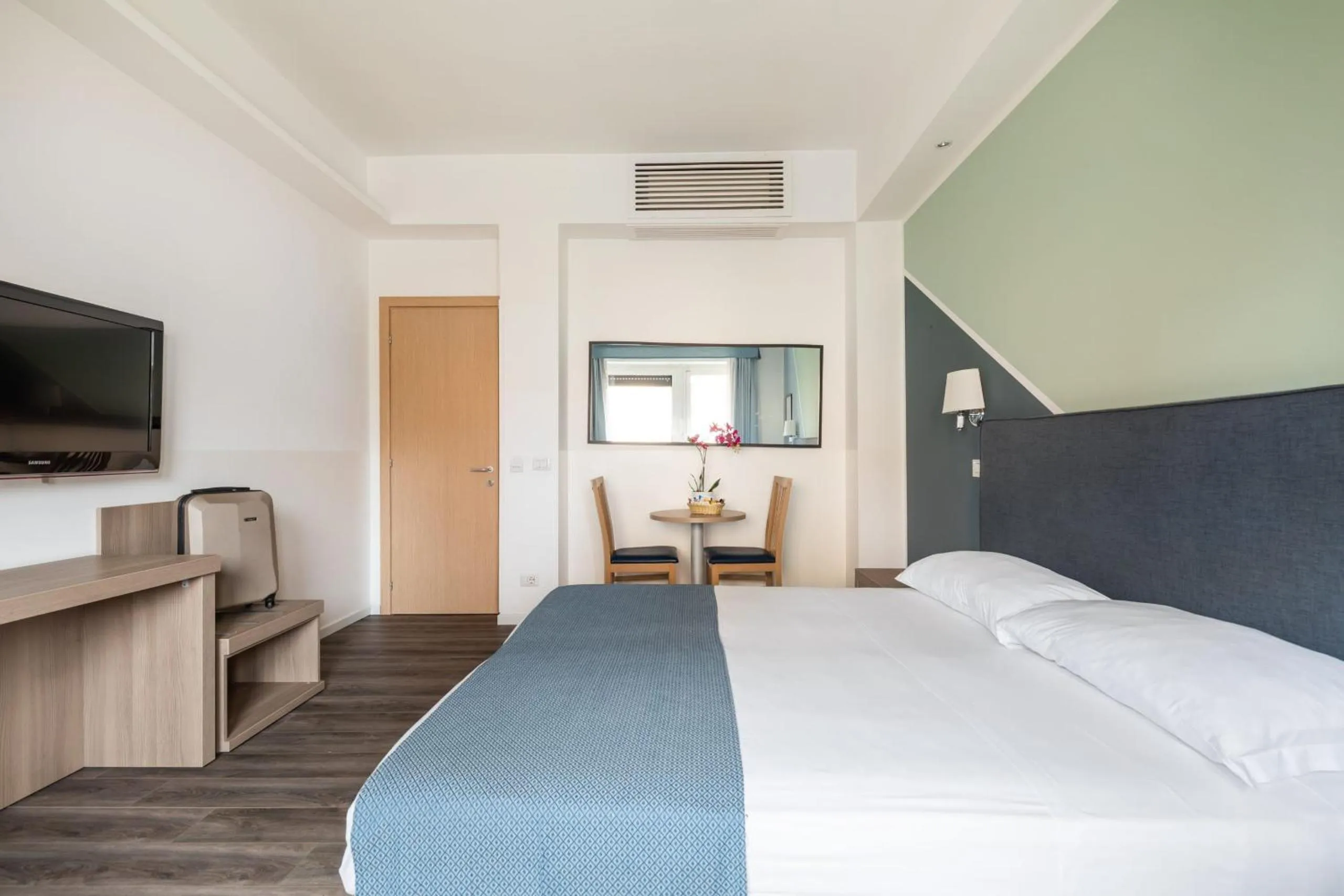 Bed in Fleming Suites by Hili