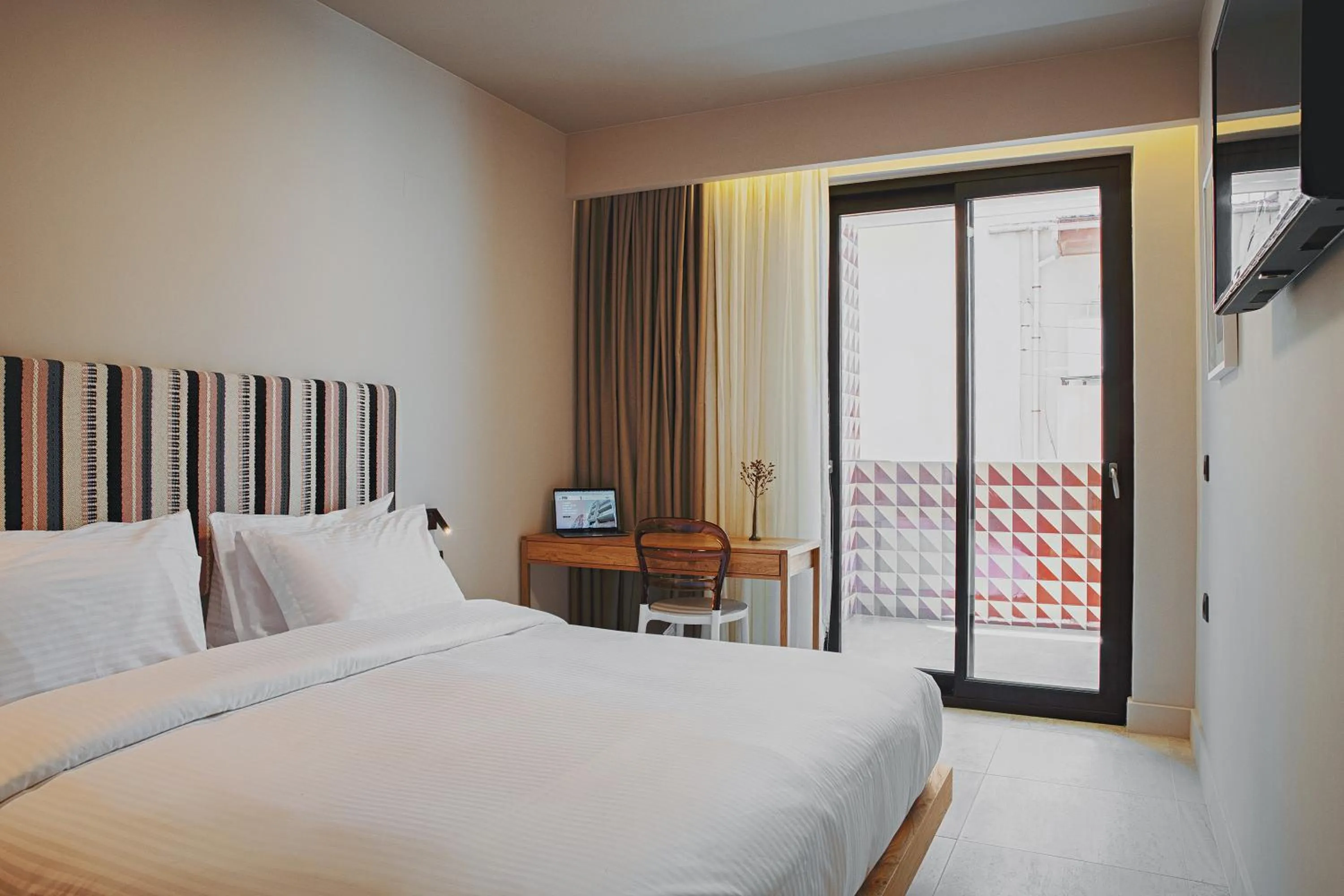 Bed in Pavo Art Hotel