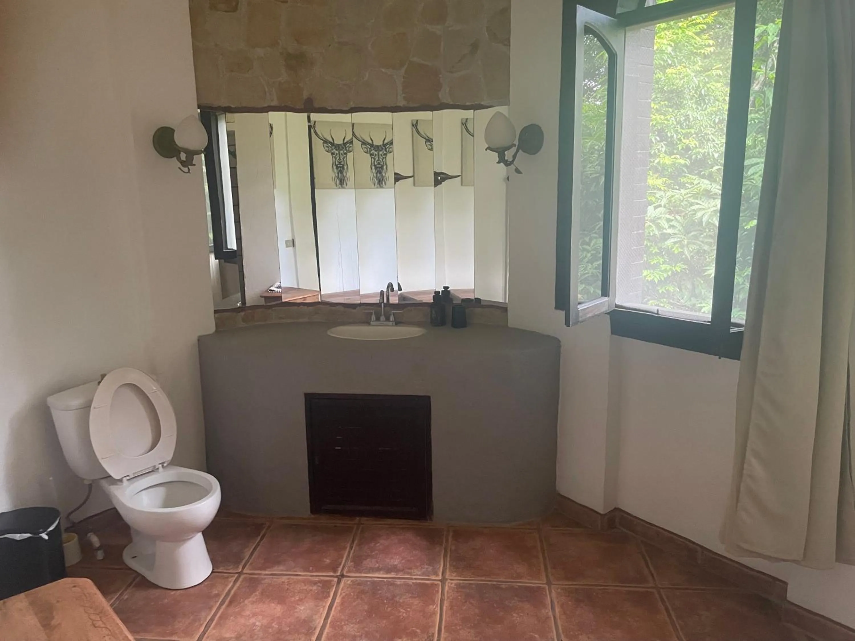 Toilet in spirit of jungle lodge