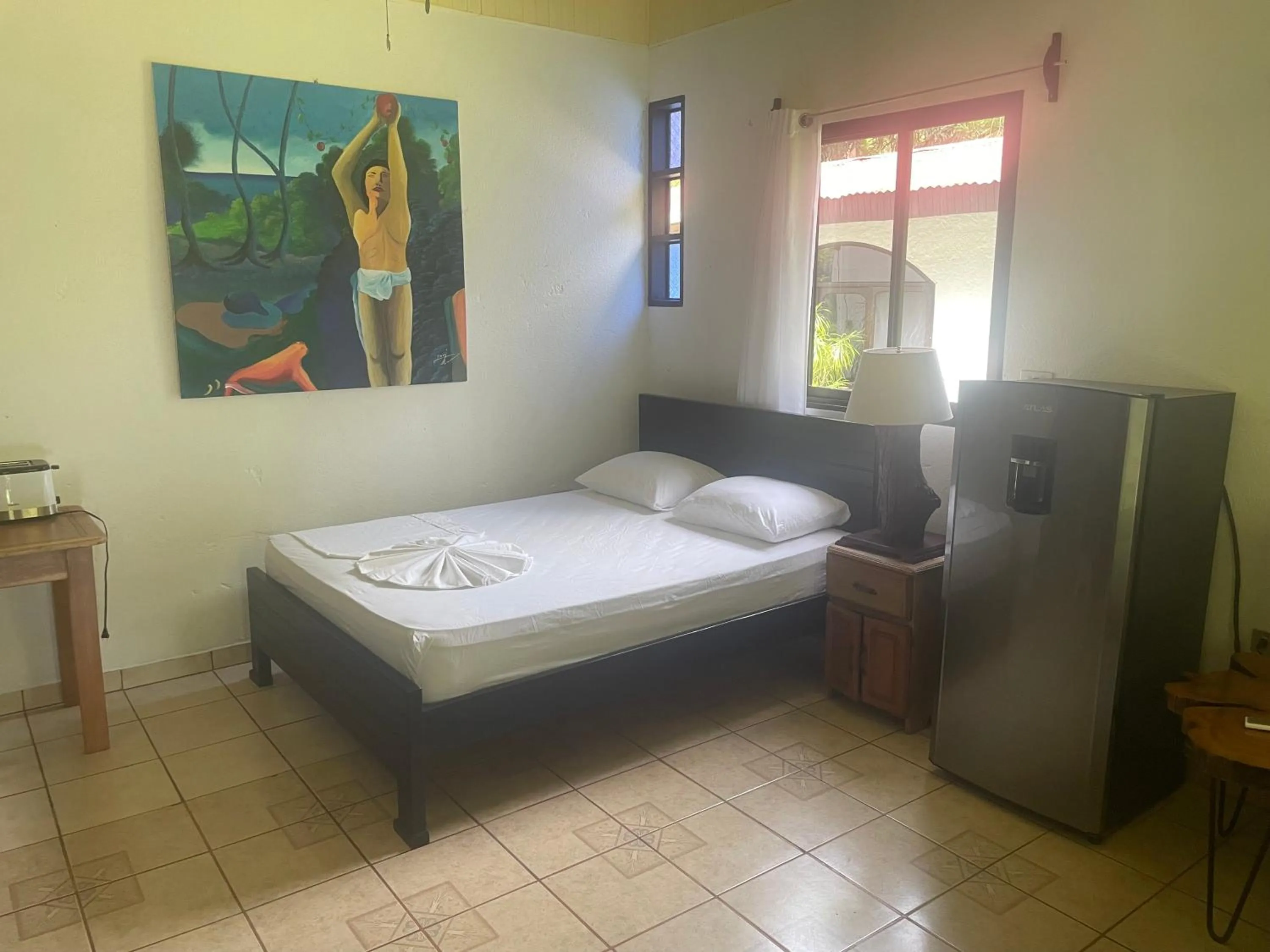 Bed in spirit of jungle lodge
