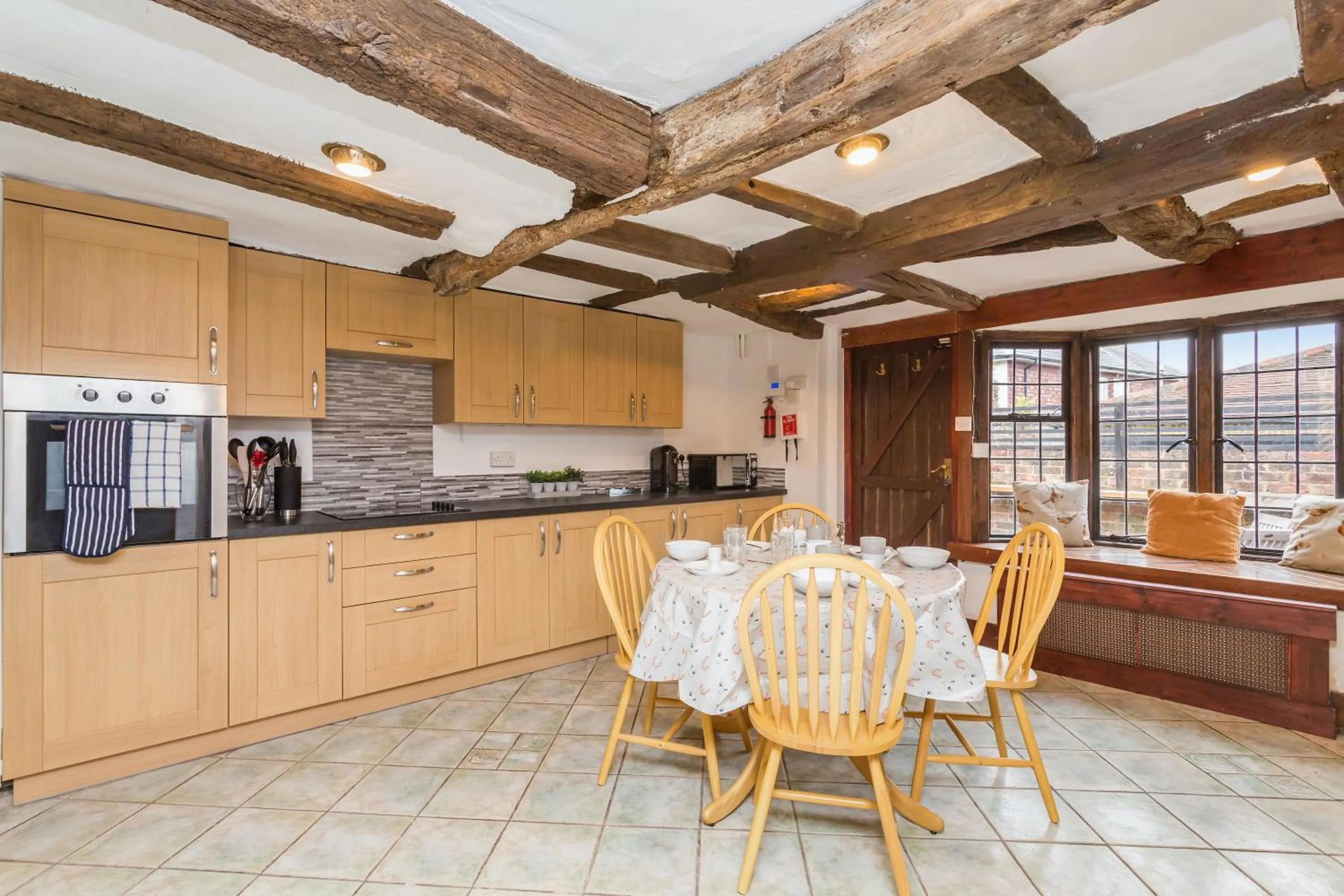 Kitchen or kitchenette in Dyke Farm Barn near Brighton by Huluki Sussex Stays
