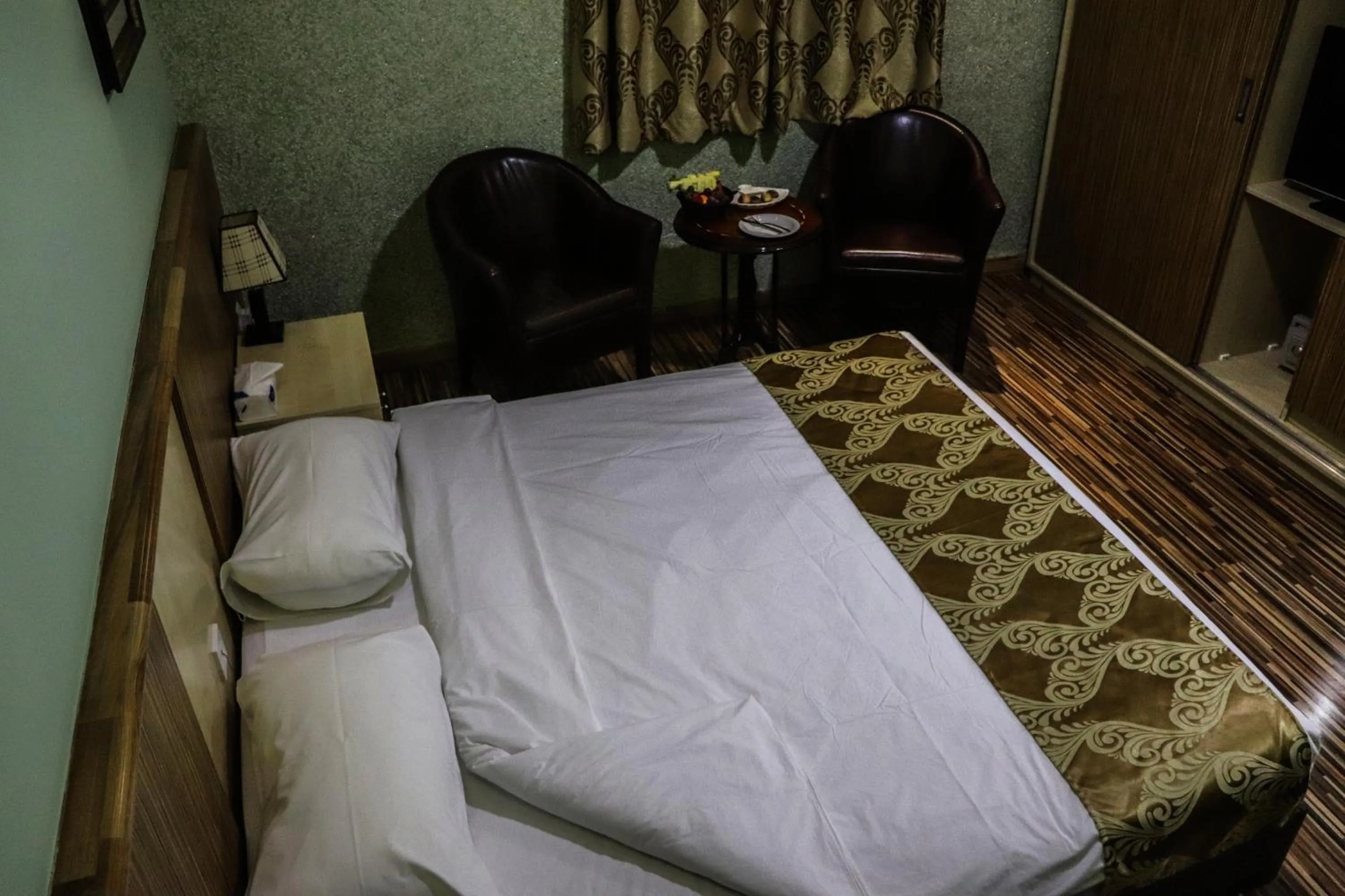 Bed in Palm Hotel