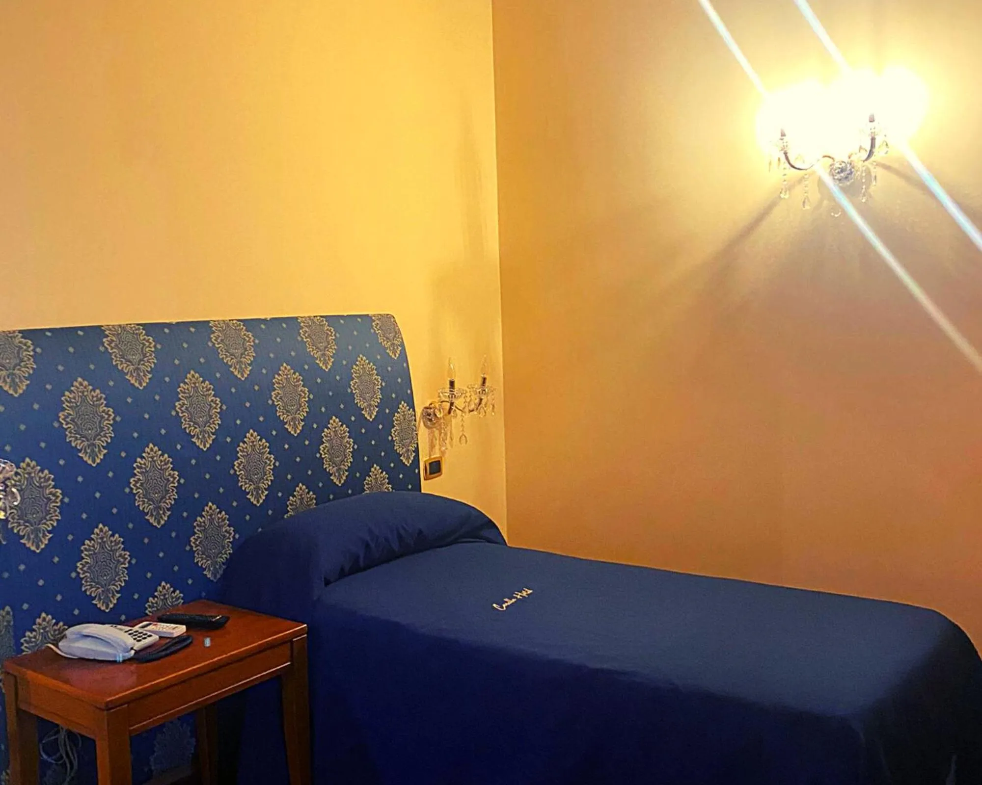 Bed in CANELLA HOTEL