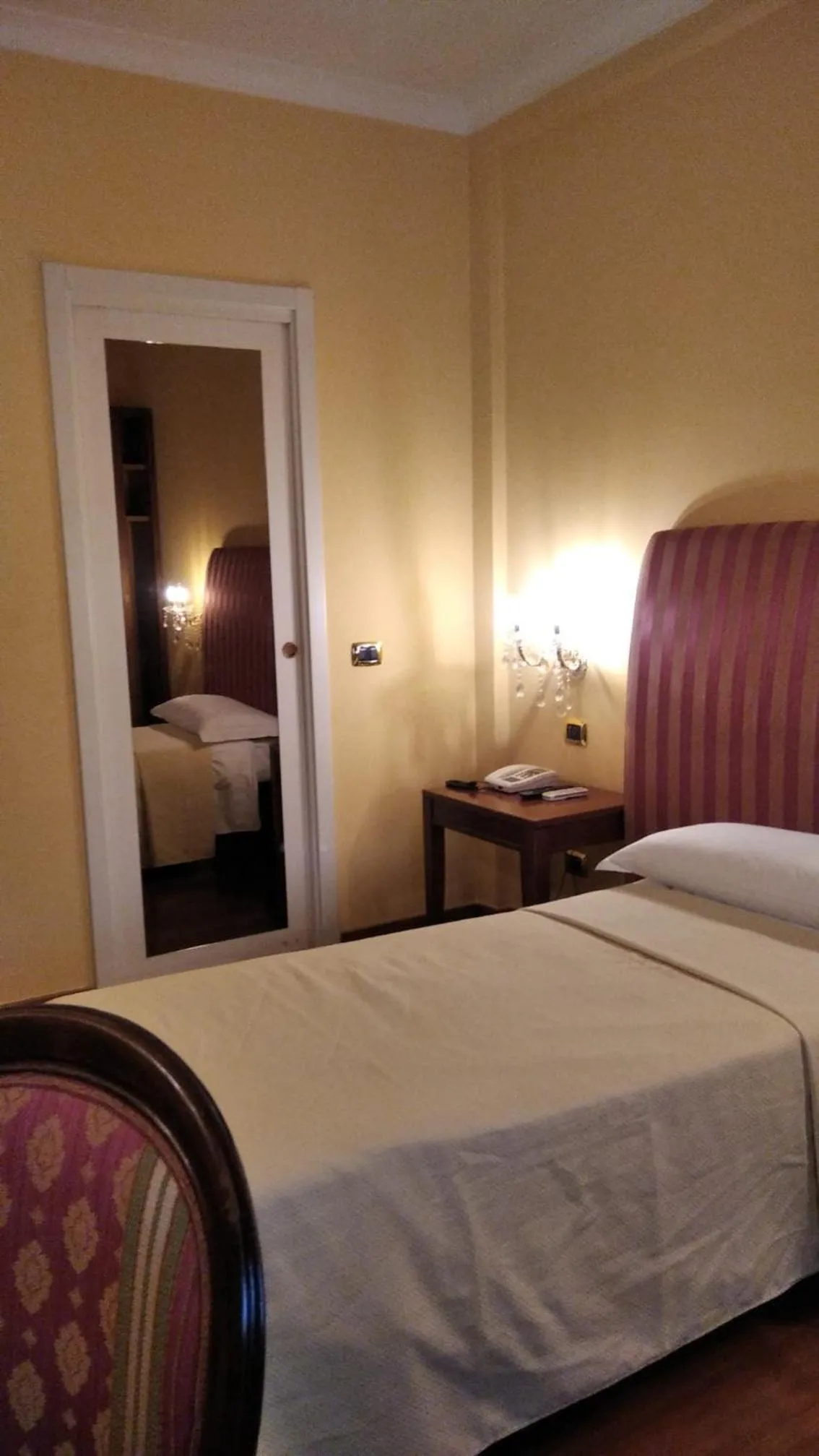 Bed in CANELLA HOTEL