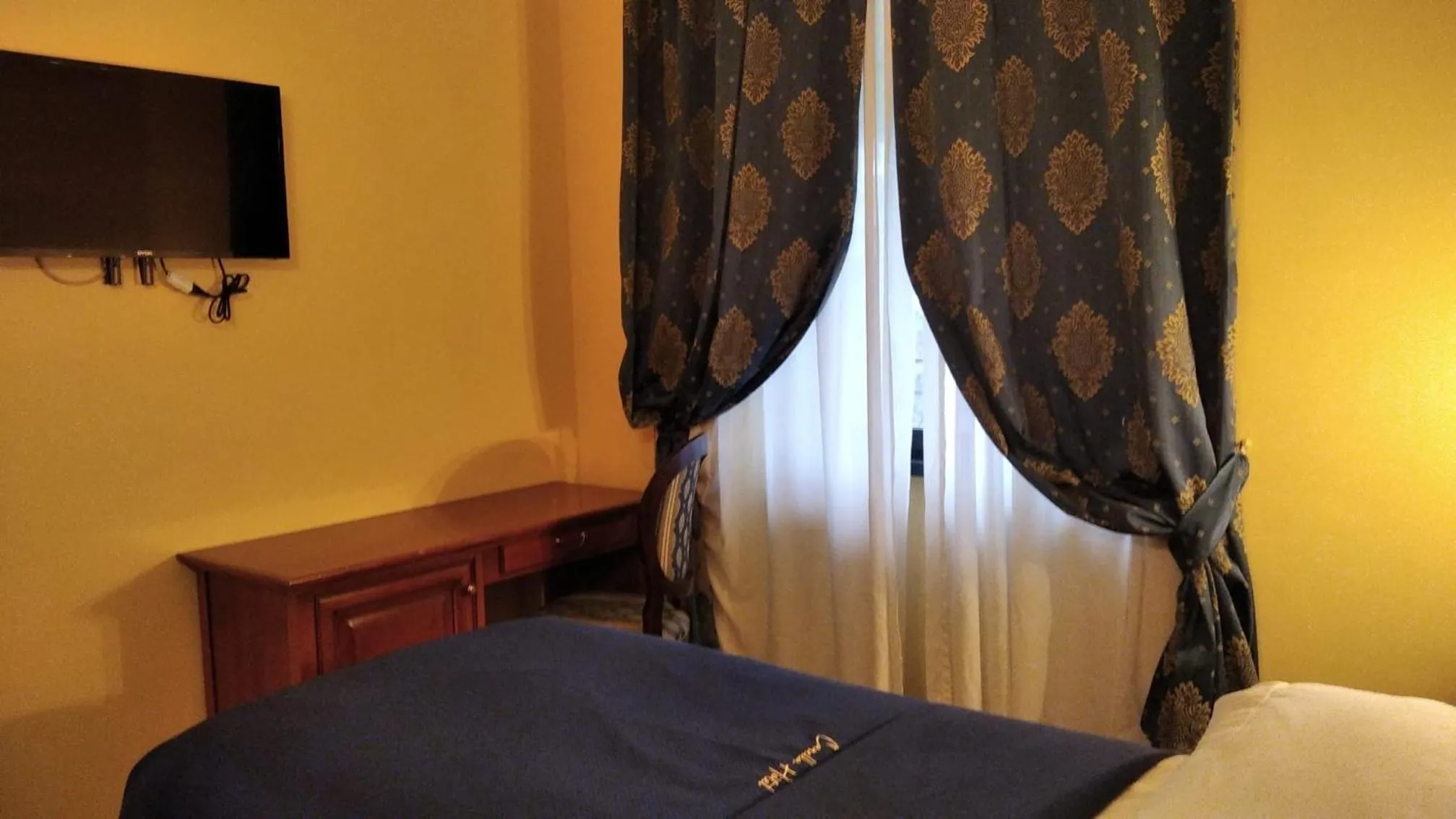 Photo of the whole room, TV/Entertainment Center in CANELLA HOTEL