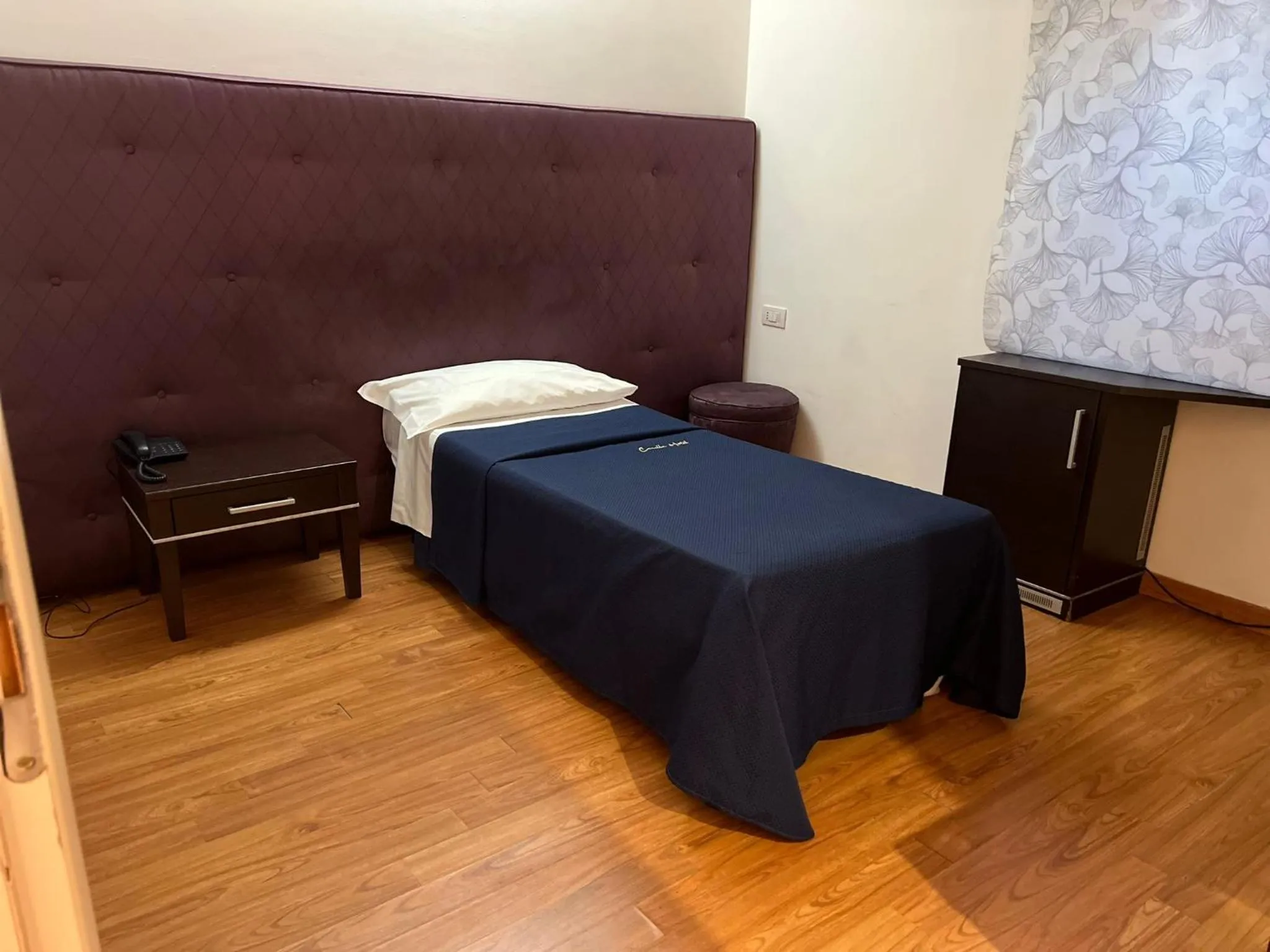 Bed in CANELLA HOTEL