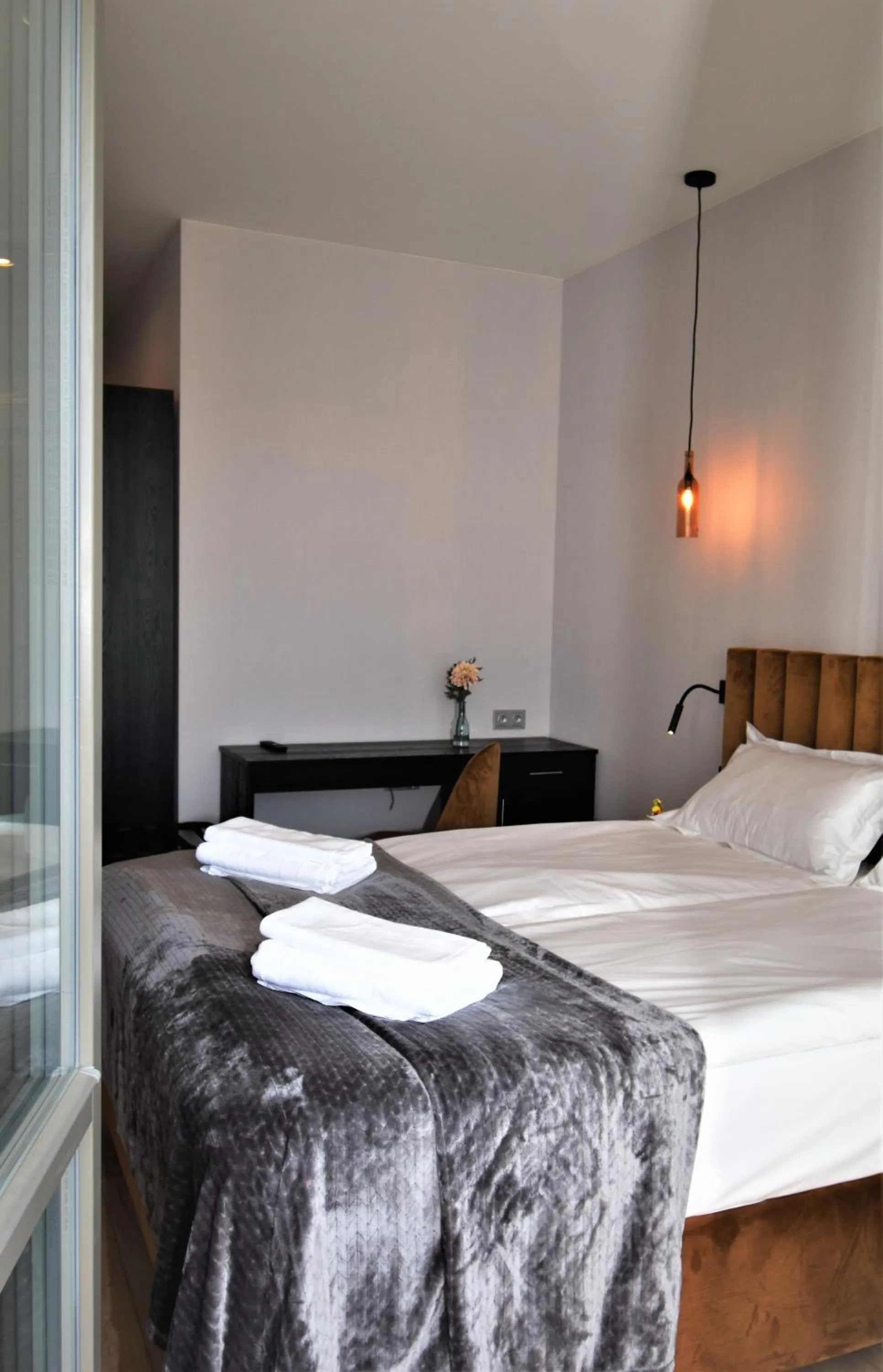 Bed in Patio Riverfront Aparthotel