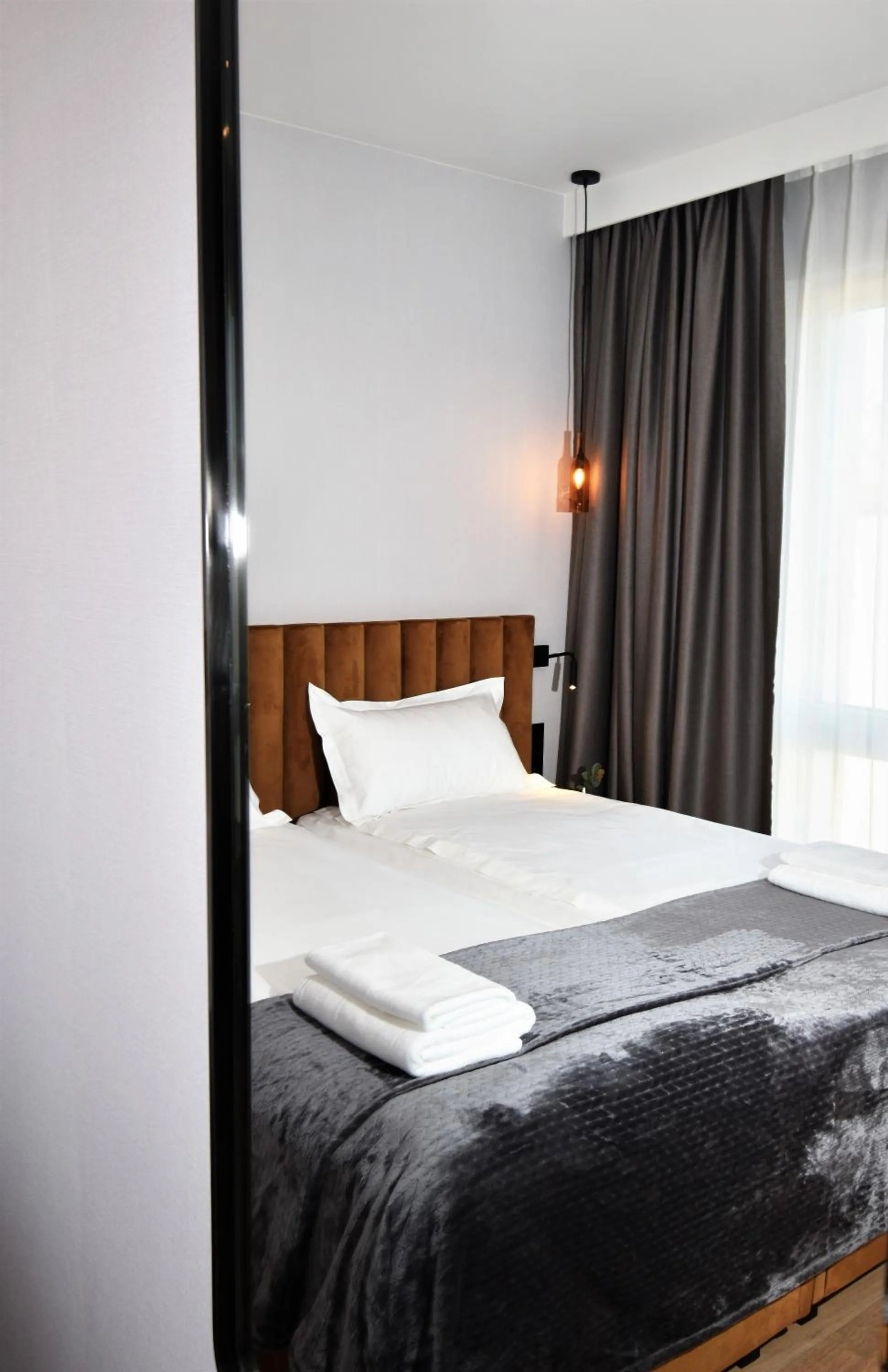 Bed in Patio Riverfront Aparthotel