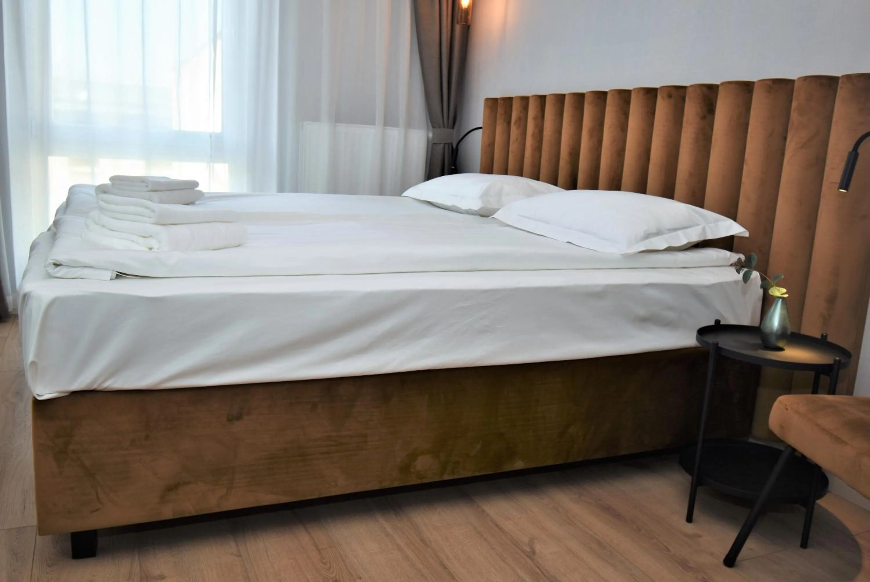 Bed in Patio Riverfront Aparthotel