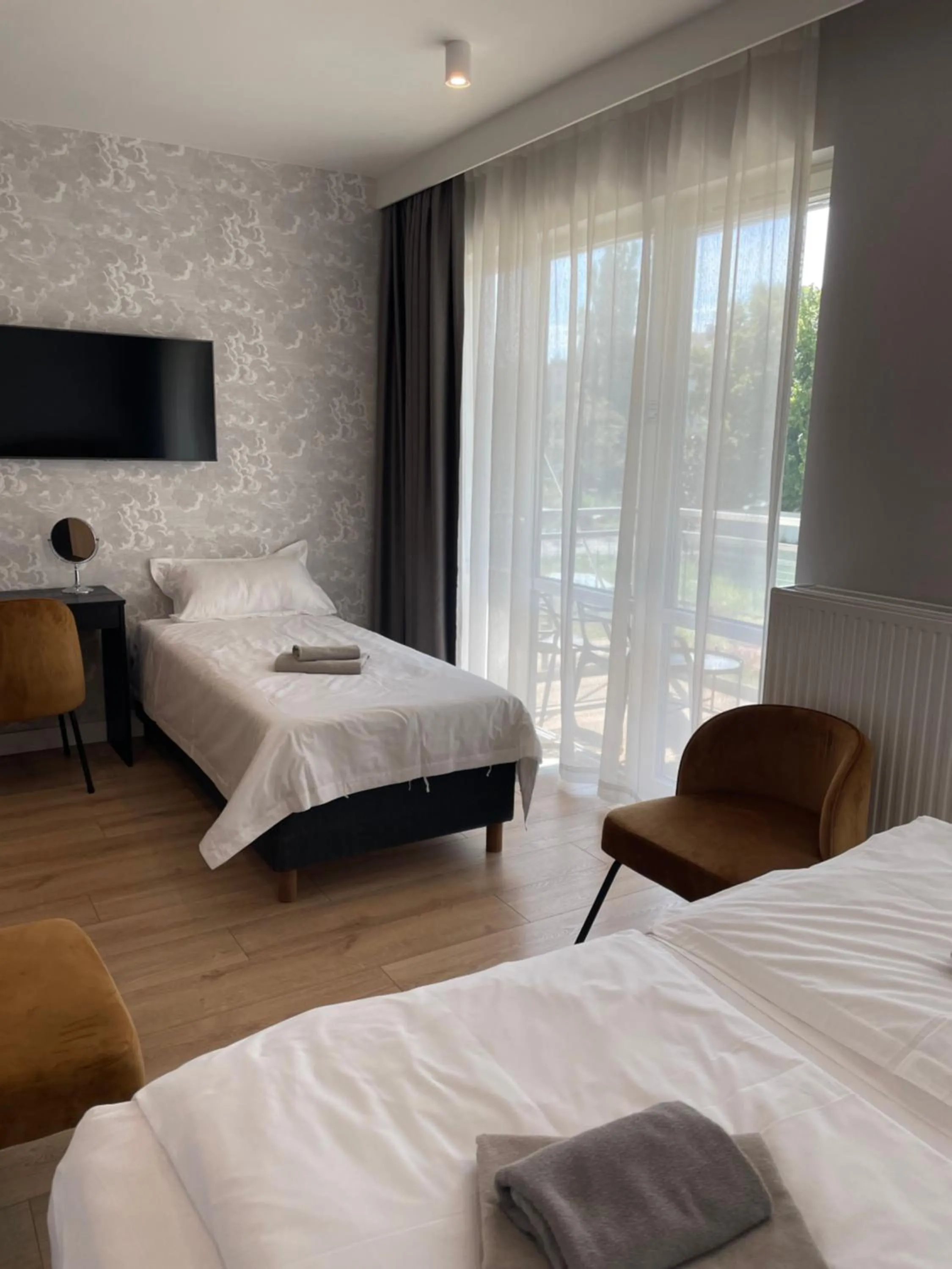 Bed in Patio Riverfront Aparthotel