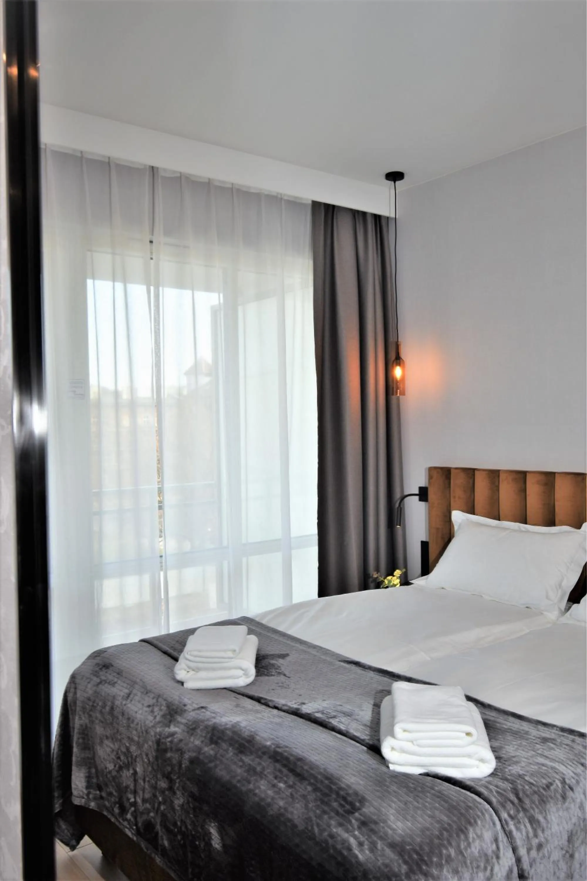 Bed in Patio Riverfront Aparthotel