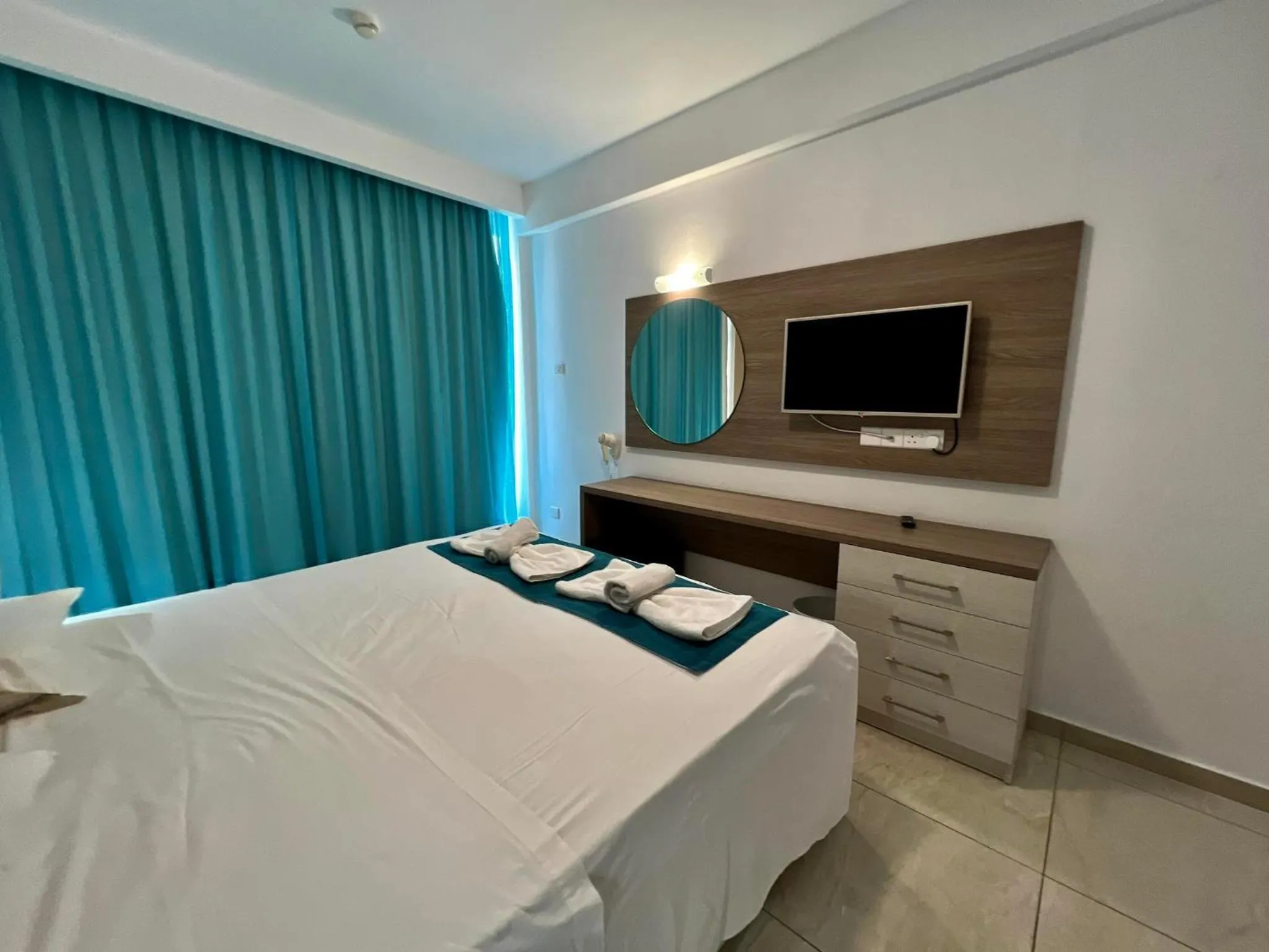 Bed in Sunny Blue Hotel