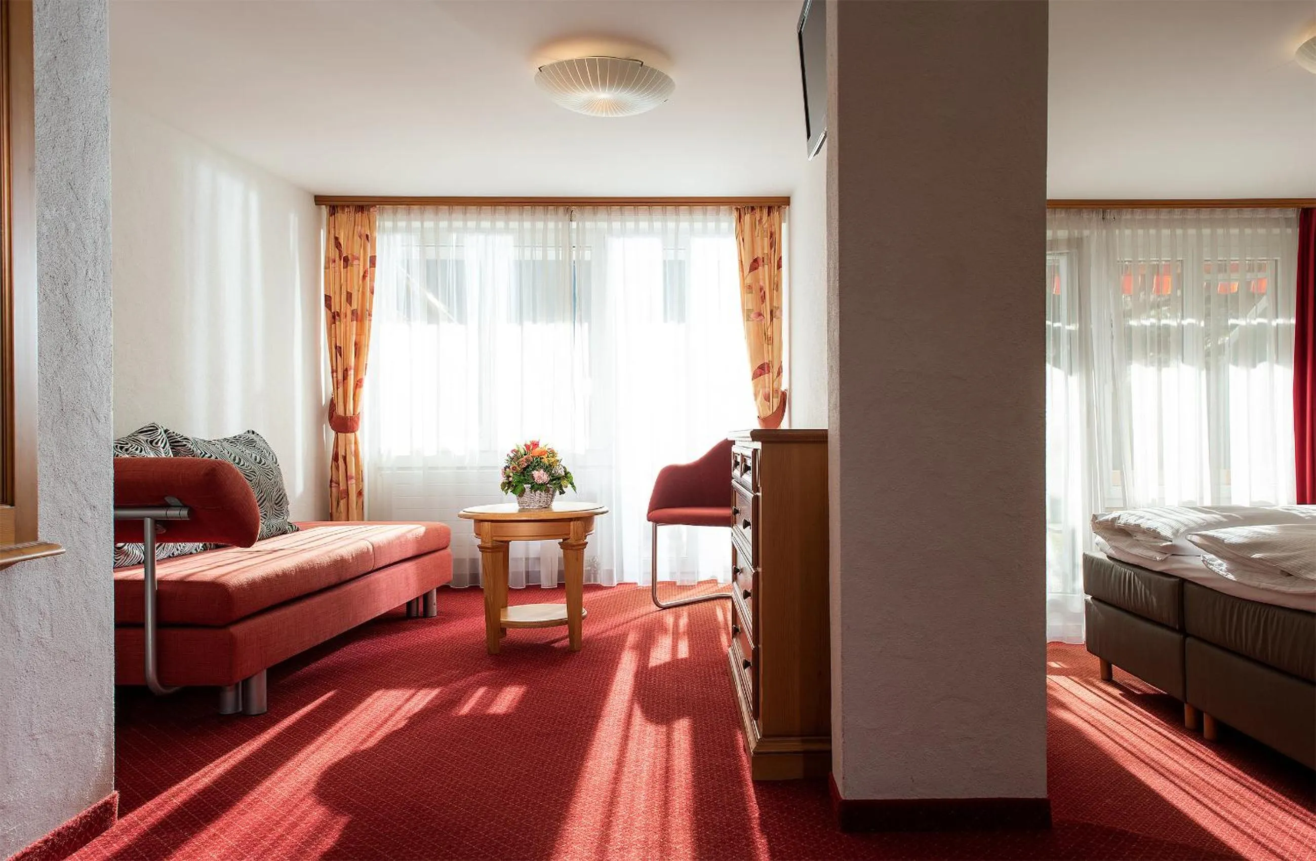 Seating area, Bed in Hotel Silberhorn