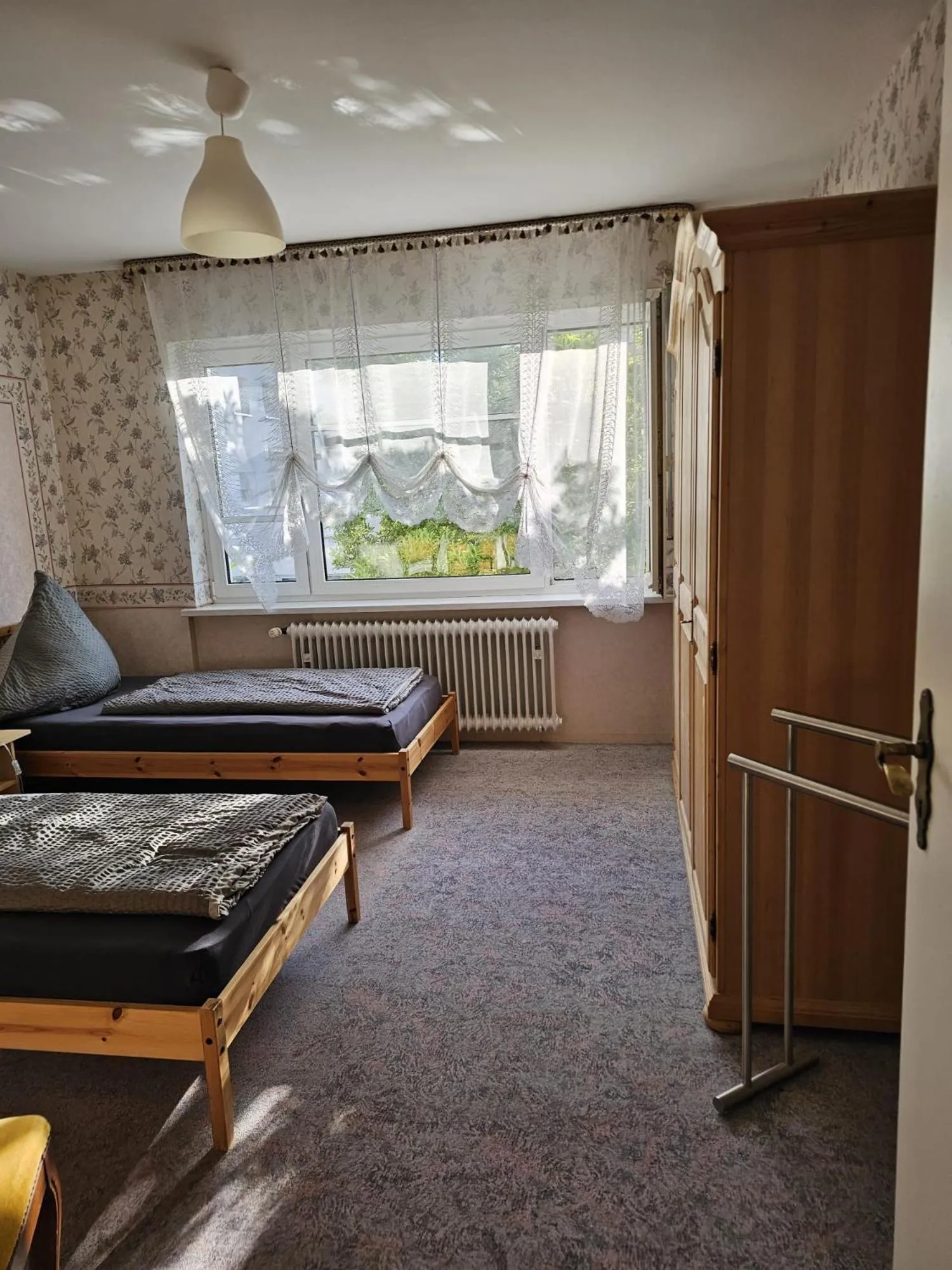 Photo of the whole room, Bed in Gästehaus3land in Weil am Rhein