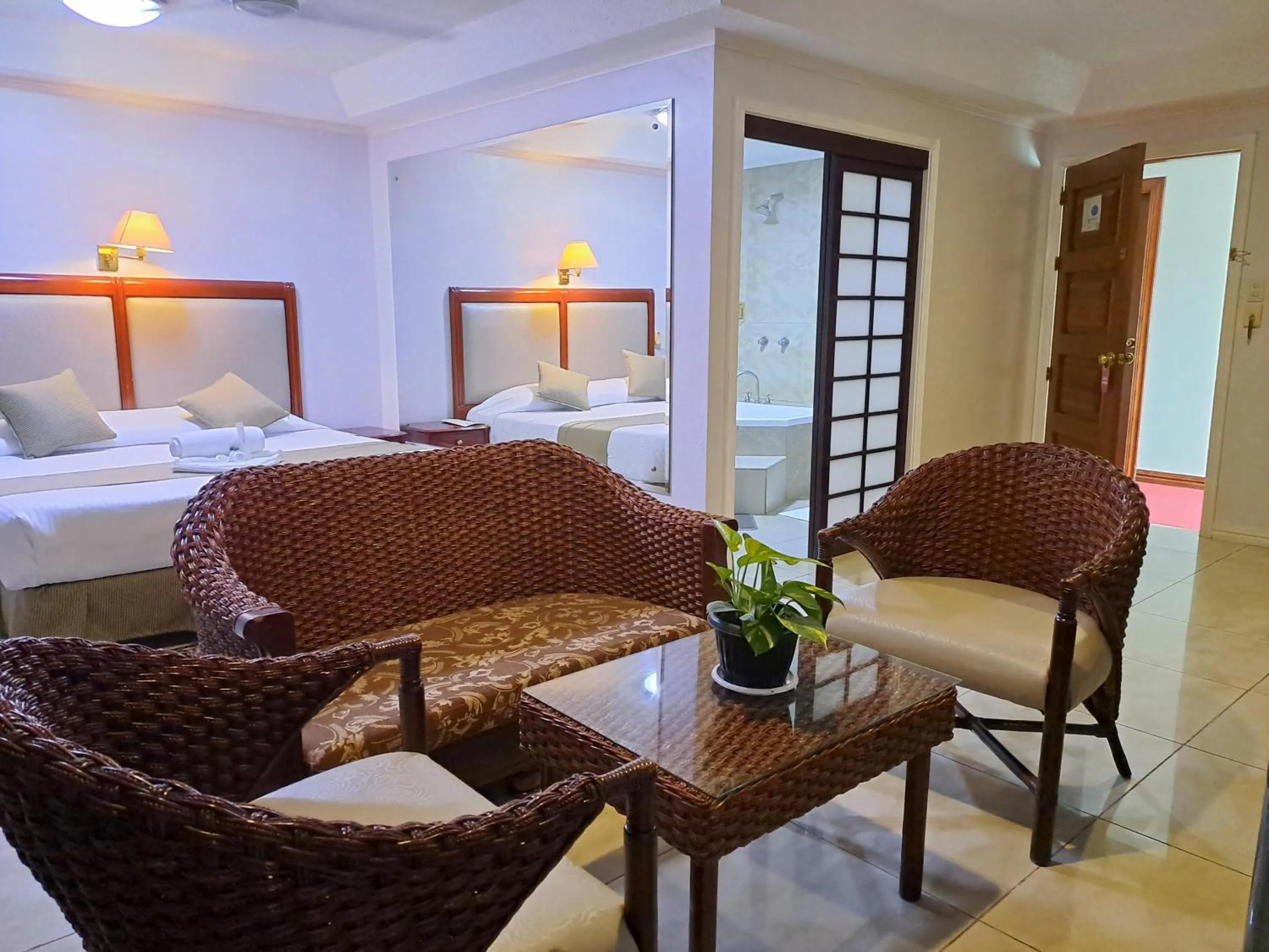 Seating area, Bed in Wild Orchid Resort