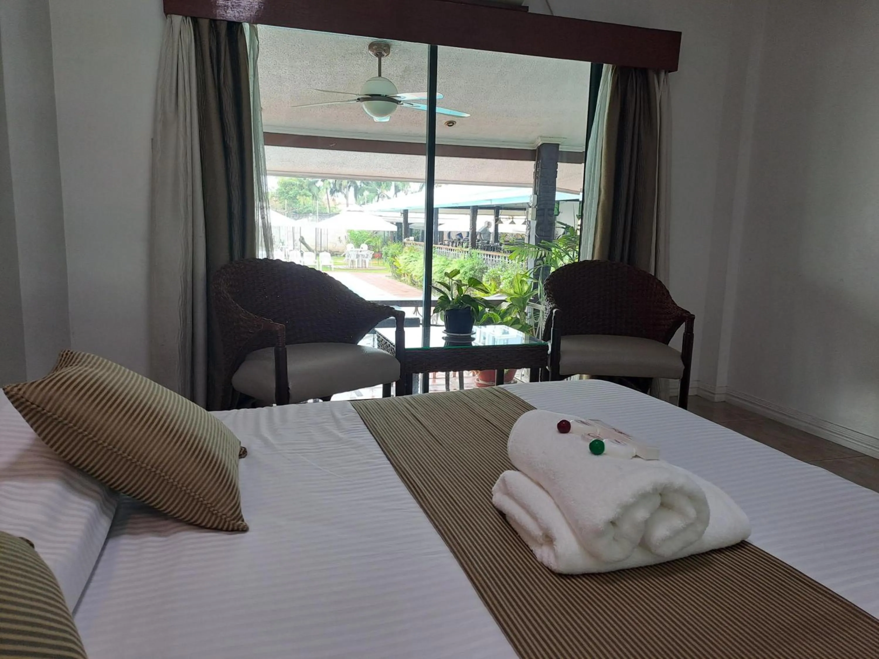 Photo of the whole room, Bed in Wild Orchid Resort