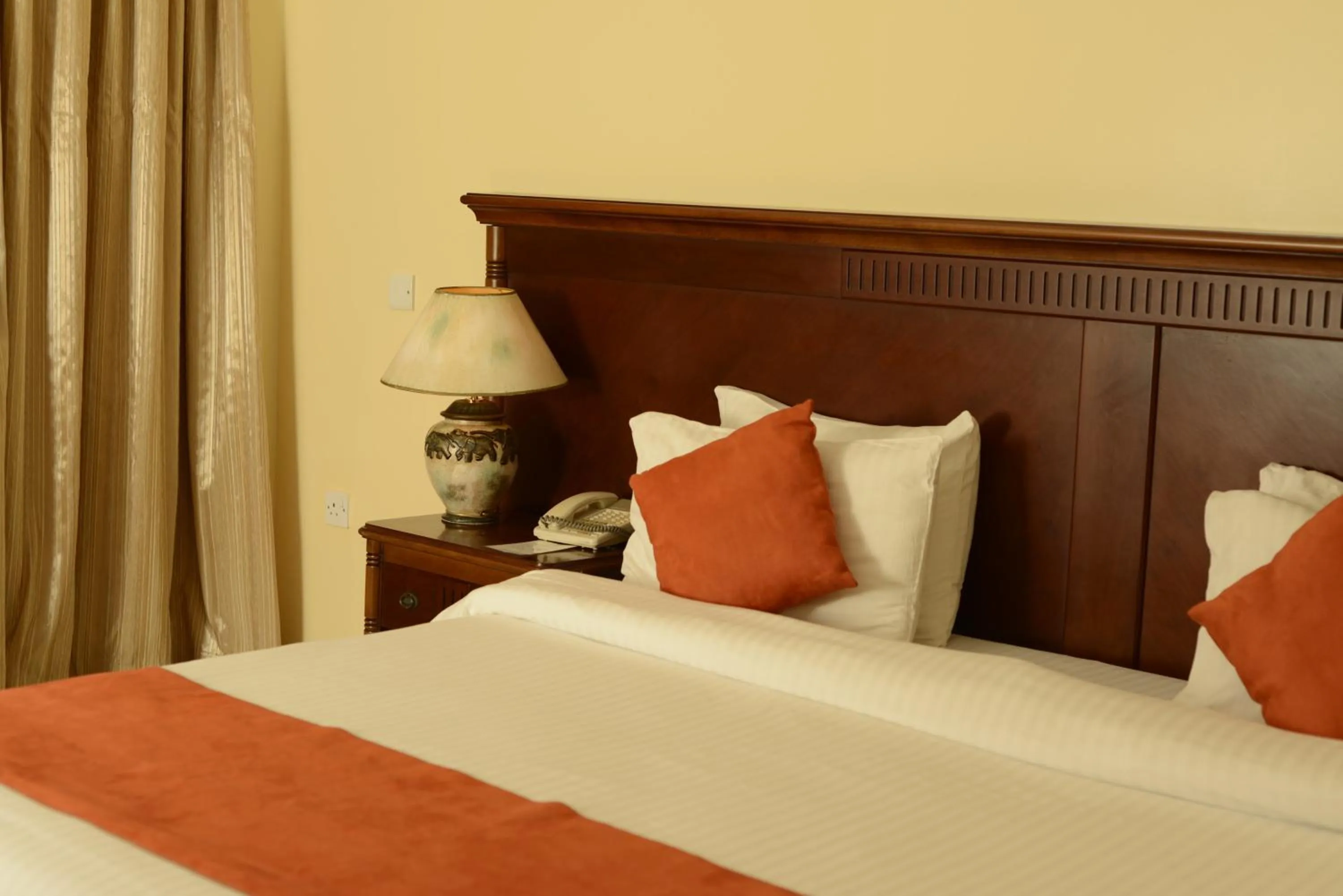 Bedroom in Golden Tulip Tanzania